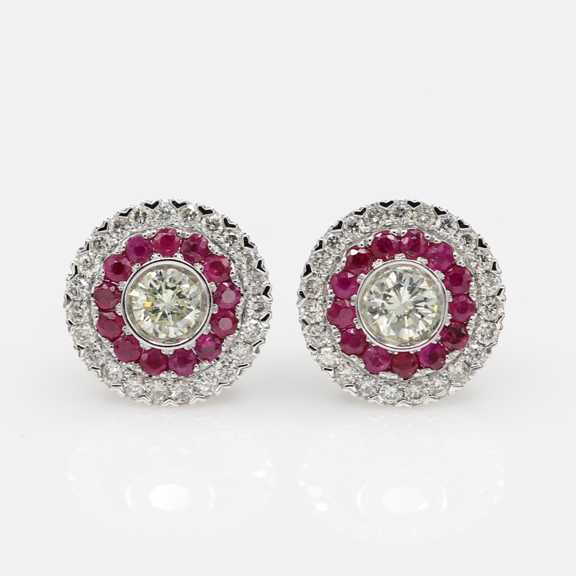 Brilliant Art Deco Style Earrings. 18k White Gold 4.20 grams. Total all Diamonds 0.98 carat GH-SI.
Total  Ruby 0.63 carat.  diameter size approx 12 mm. Push Back type of closure.
All stones are Natural.