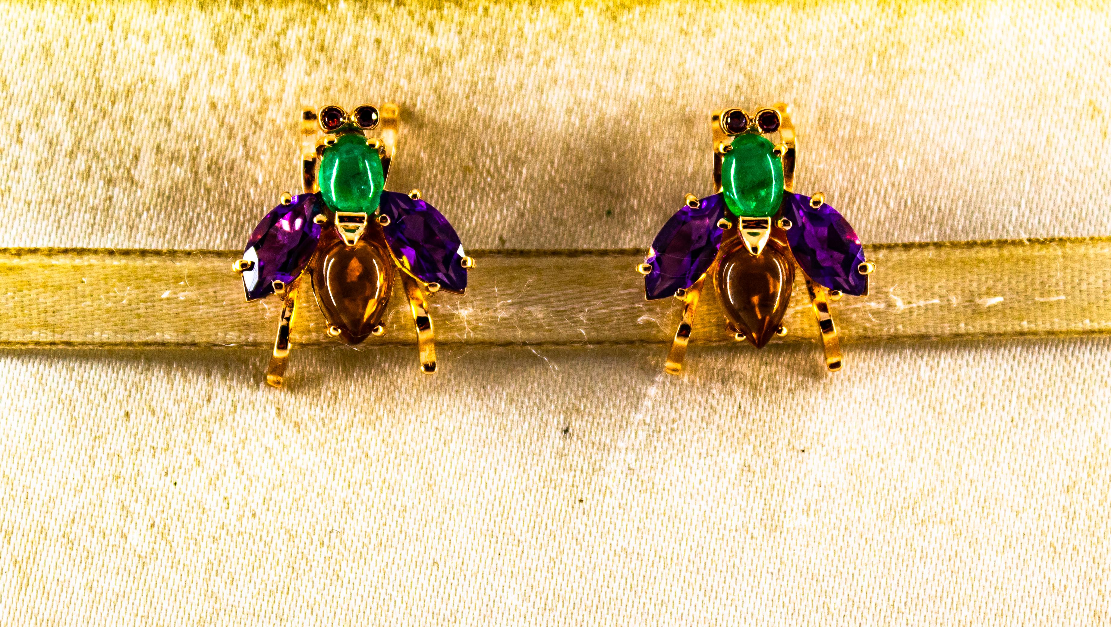 These Stud Earrings are made of 14K Yellow Gold.
These Earrings have 0.08 Carats of Rubies.
These Earrings have 0.90 Carats of Emeralds.
These Earrings have 2.00 Carats of Citrine.
These Earrings have 3.00 Carats of Amethyst.

These Earrings are