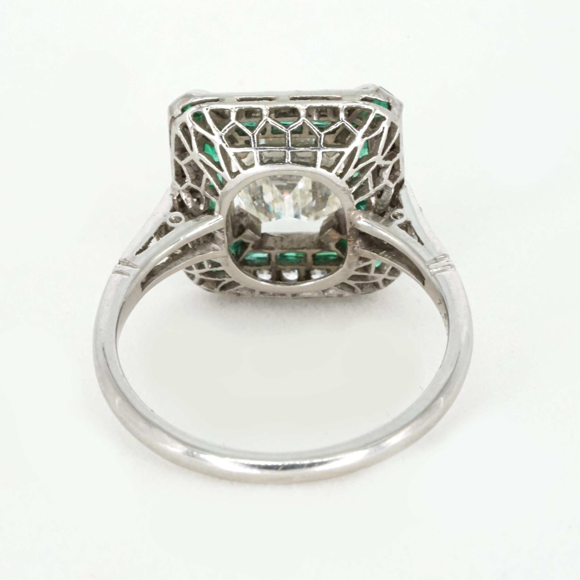 This breathtaking antique Art Deco ring features a stunning 1.57-carat emerald-cut diamond at its center. The diamond is graded I-J in color and SI1-SI2 in clarity, showcasing its timeless step-cut design that enhances both its brilliance and