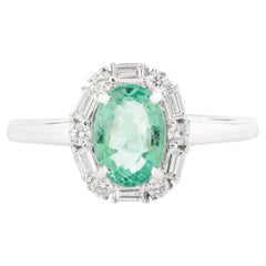 0.73 Carat Oval Emerald Engagement Ring with Halo Diamonds in 14k White Gold