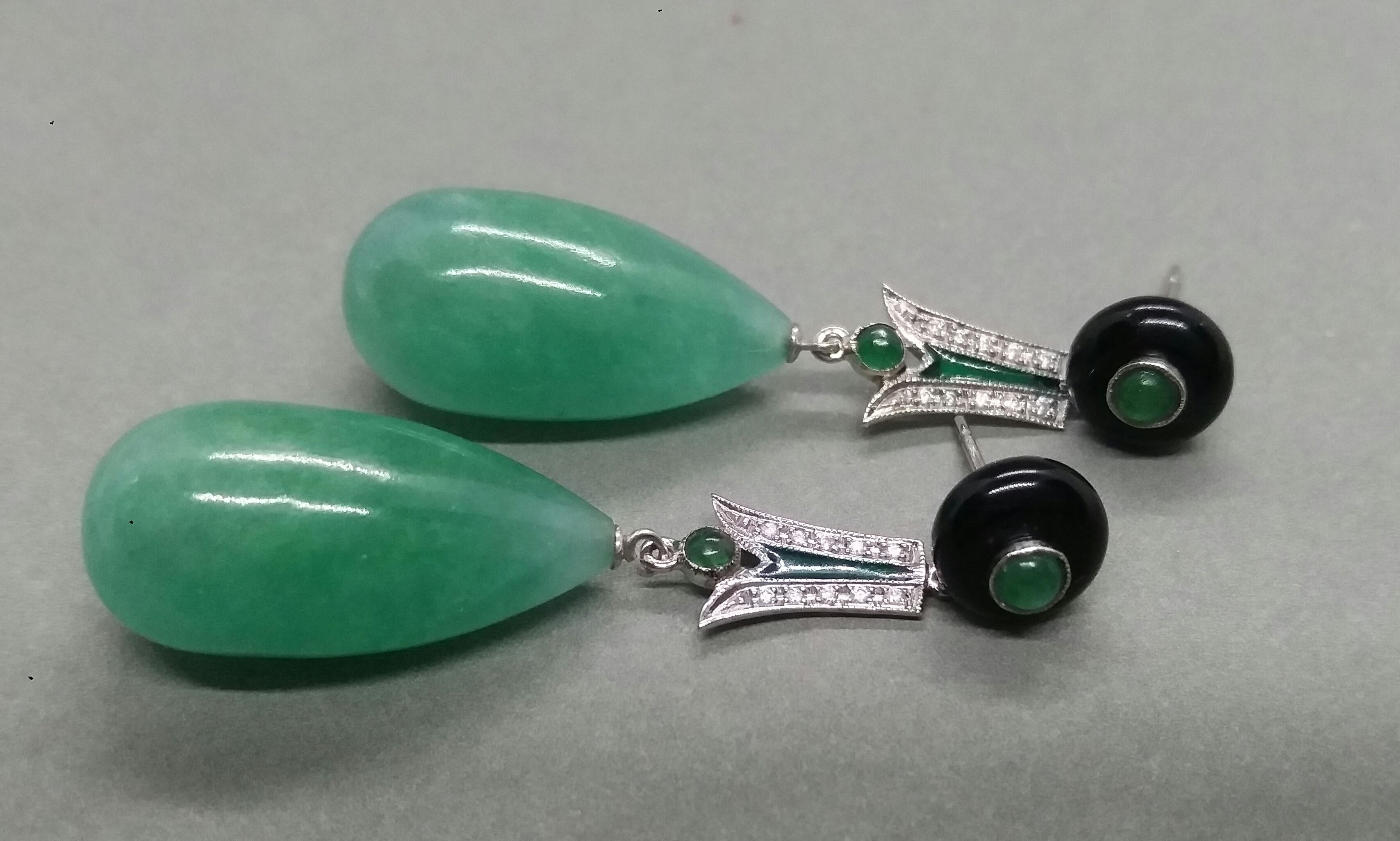 In these classic totally handmade Art Deco Style earrings we have 2 round black onix buttons with small round Emeralds in the center,middle parts in white gold,small round emerald cabs,20 small round full cut diamonds,green enamel,2 Burma Jade round