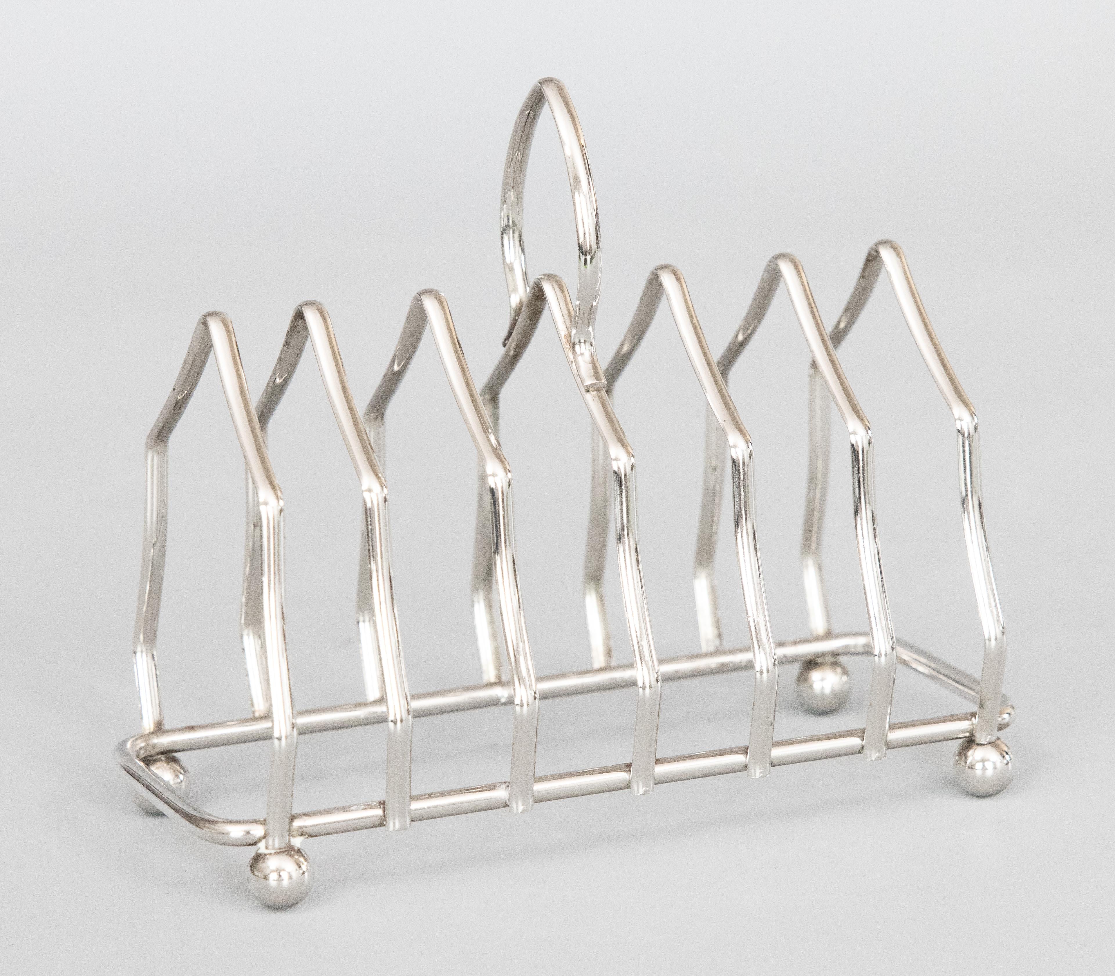 A stylish vintage Art Deco English silverplated six slice toast rack, circa 1950. Marked 