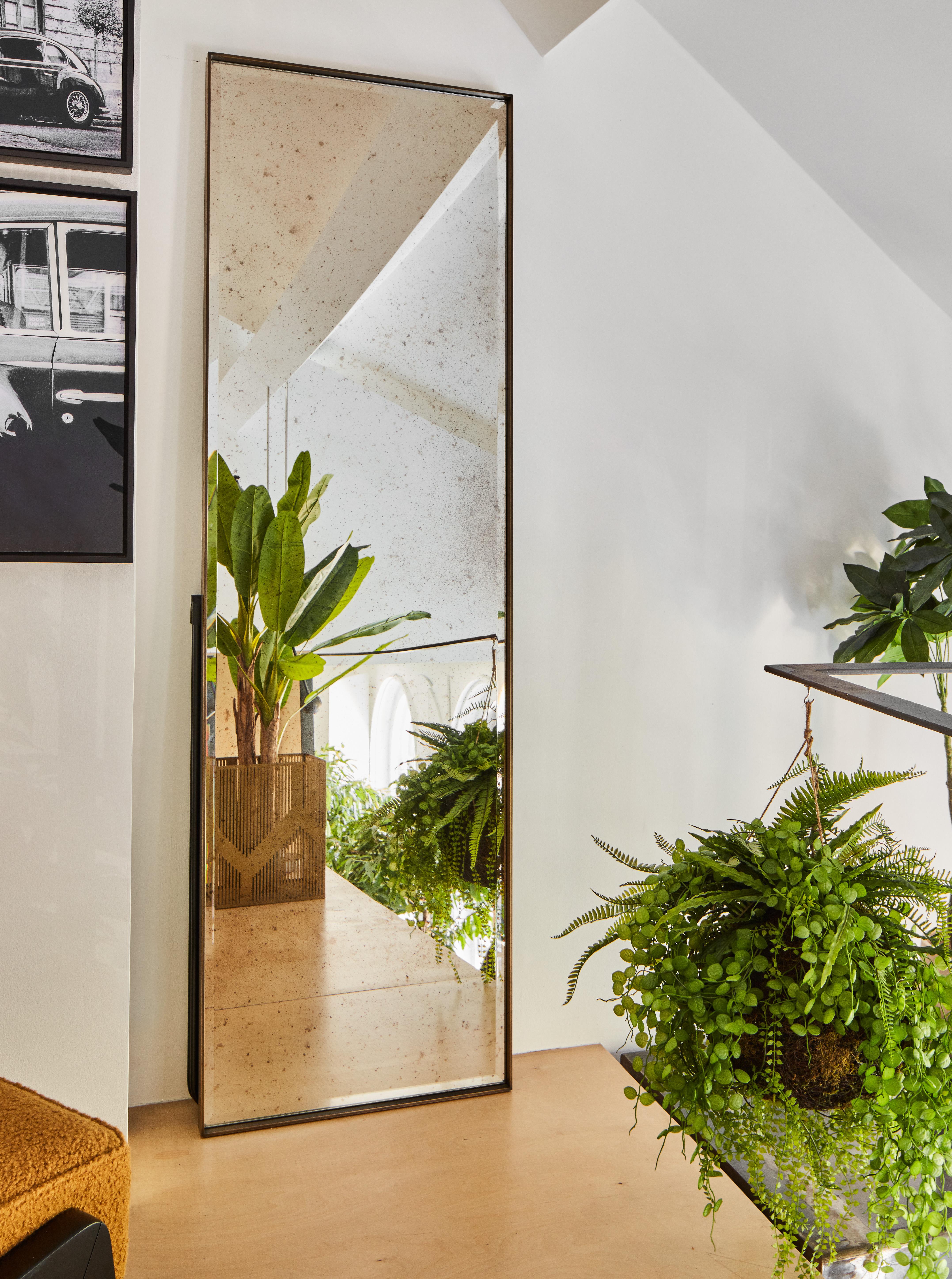 Introducing the Slim Mirror by Casa Botelho - a luxurious and masculine piece of home decor that is designed to make a bold statement. Standing tall at 210 cm height, this mirror features an exaggerated frame that adds a touch of drama and