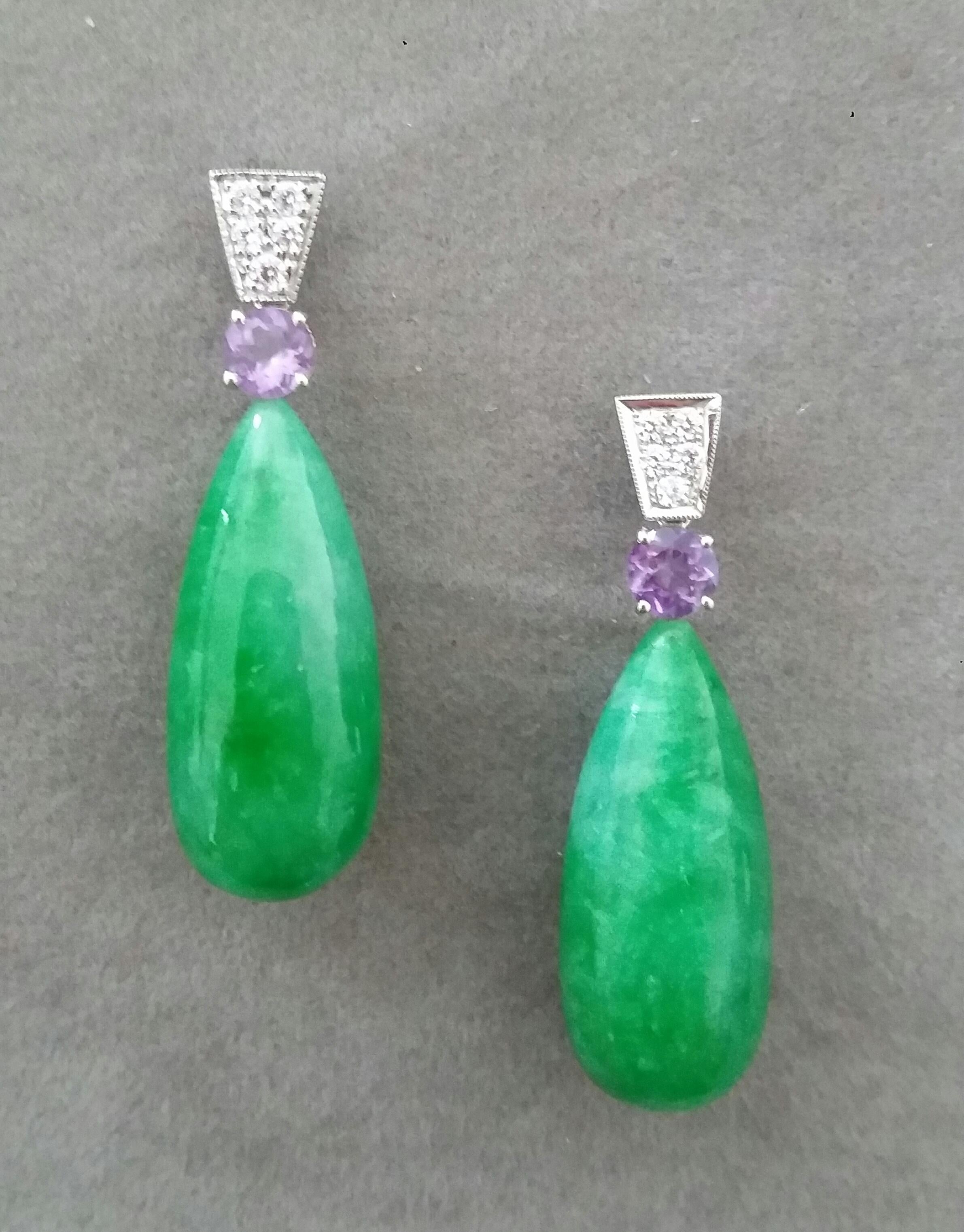 In these classic and chic Art Deco Style earrings the tops are 2 trapeze shape 14 kt.white gold parts with  10 round full cut diamonds and 2 round faceted natural Amethysts,in the lower parts we have 2 Jade Plain Round Drops  measuring  12 x27 