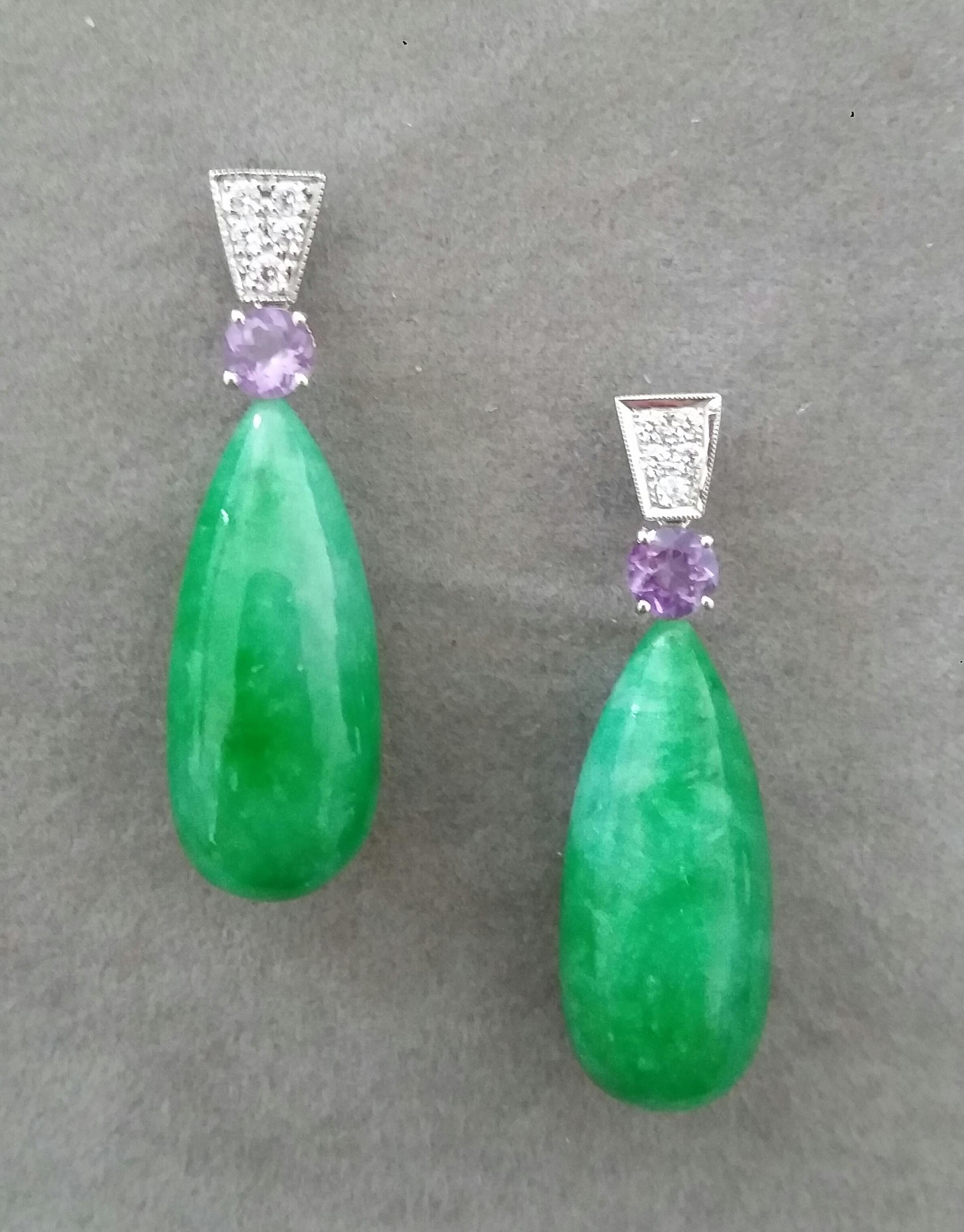 In these classic and chic Art Deco Style earrings the tops are 2 trapeze shape 14 kt.white gold parts with  10 round full cut diamonds and 2 round faceted natural Amethysts,in the lower parts we have 2 Jade Plain Round Drops  measuring  12 x27 