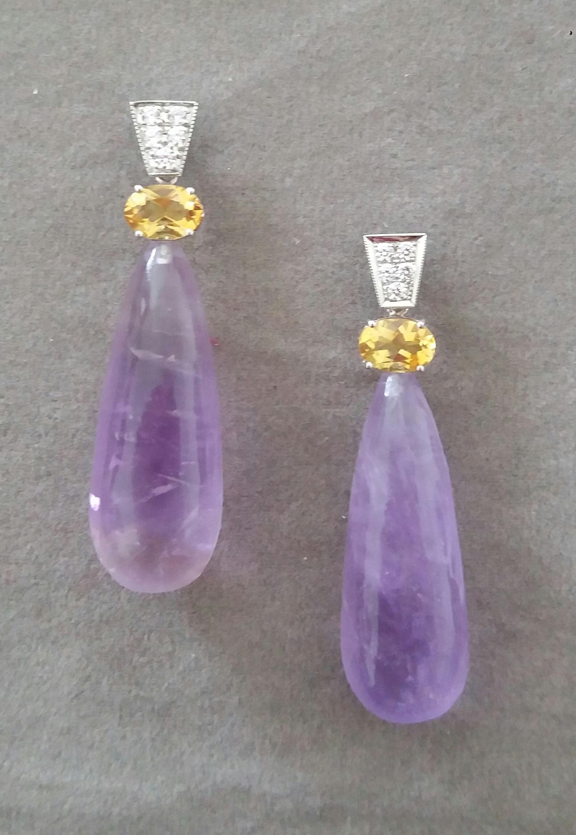 In these classic and chic Art Deco Style earrings the tops are 2 trapeze shape 14 kt.white gold parts with  10 round full cut diamonds and 2 oval faceted natural Citrines ,in the lower parts we have 2 Amethyst Plain Round Drops  measuring  12 x33 