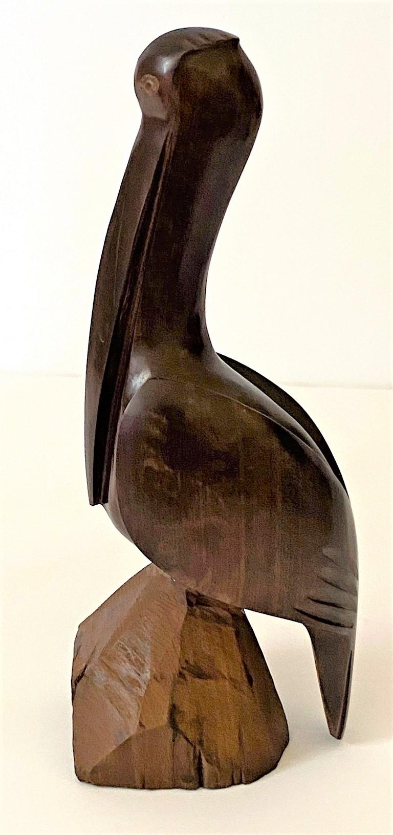 This stylish and chic hand-carved, artisan figure of a stylized pelican is very much in the Art Deco Moderne style with its elongated, clean lines and form.

 