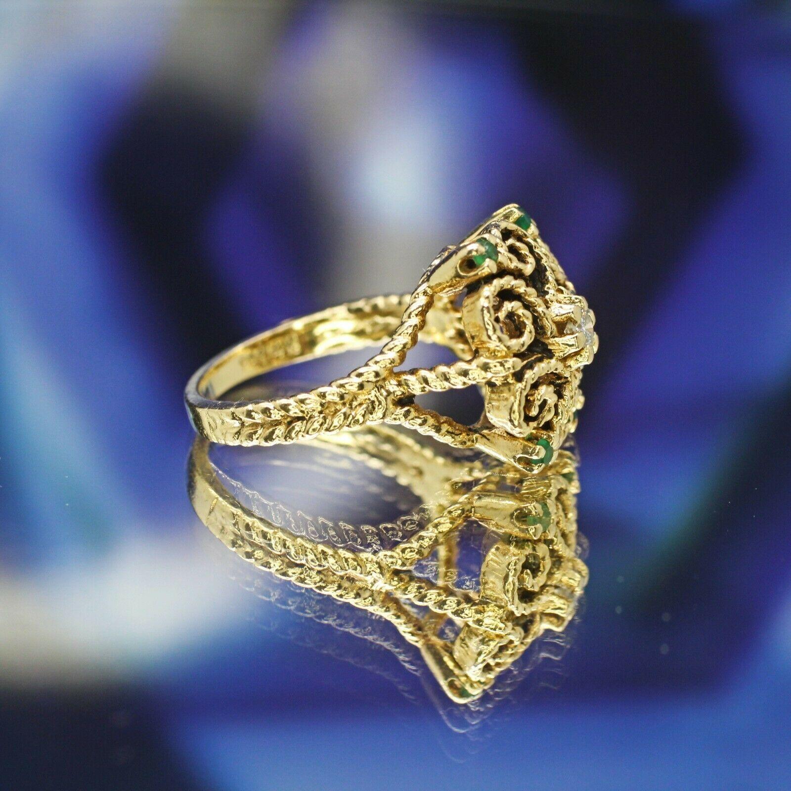   This is a very nice Art deco style filigree ring with round cut diamond in approximately 0.09 ct, and 4pcs round cut emerald stones in approximately 2mm each. This ring crafted in 14k yellow gold metal in size 6.75us. 
Specifications:
    main