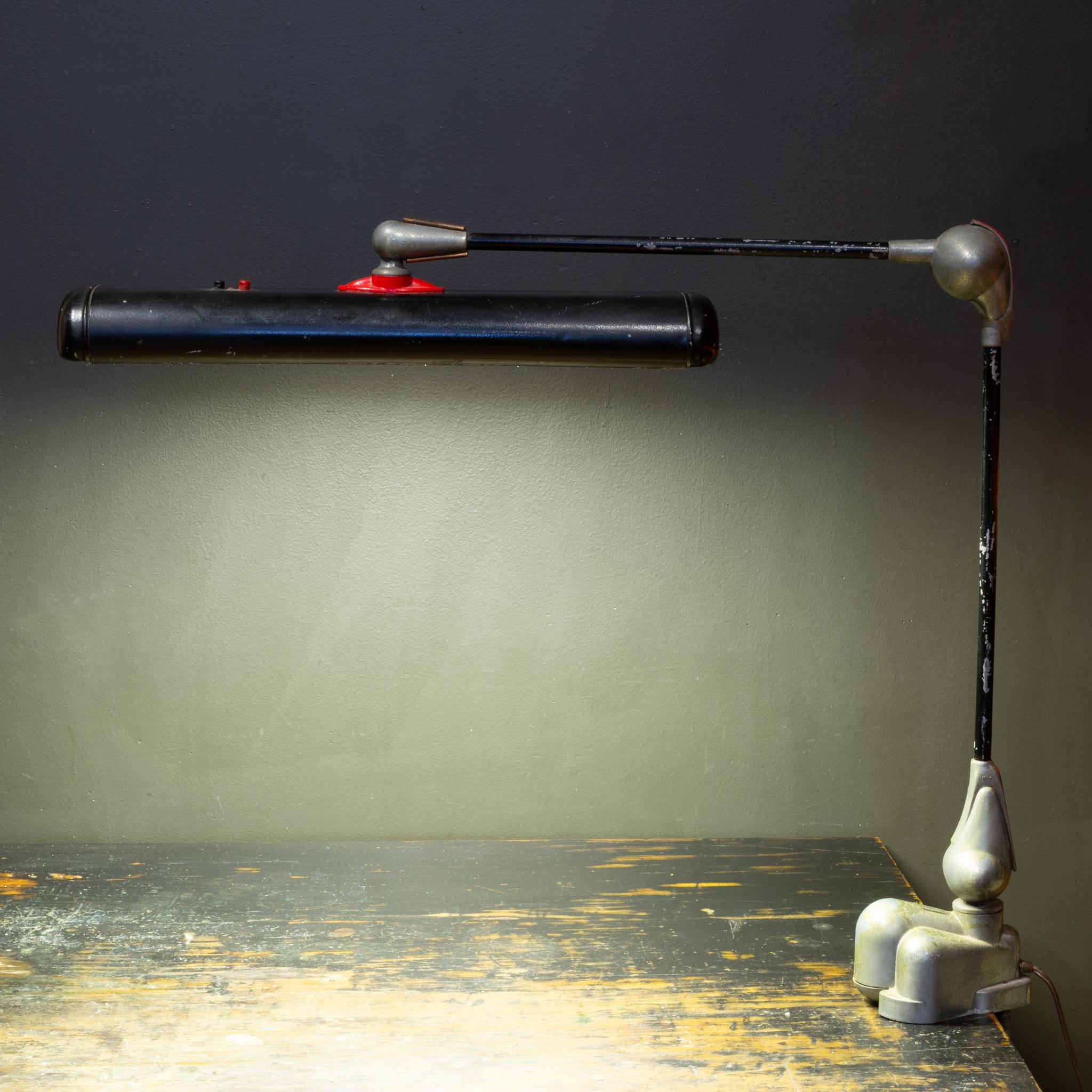 ABOUT

An original fully adjustable Art Deco style clamp on industrial drafting task lamp. Embossed company name, lamp name and patent date 1942. Red and black on/off buttons. Black, red and sliver accents with copper trim near the shade. Warm