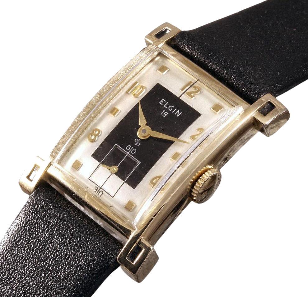 Nearly 70 years old comes to you is this fabulous gentleman's 10k gold filled  manual wrist watch made by the US watch company Elgin.  This fine example was made in 1954 and still bears the influence of the Art Deco style. This example has Just been