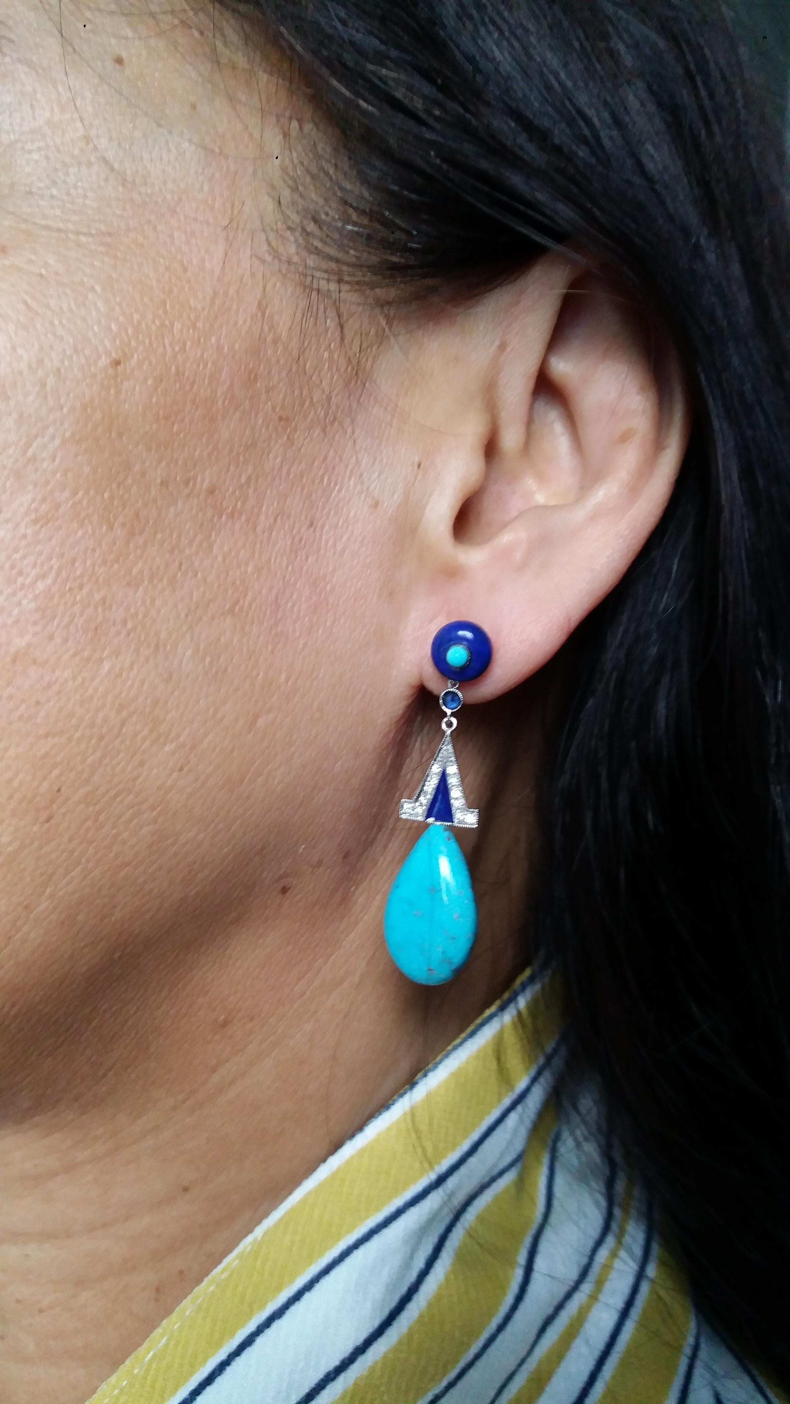 2 Lapis Lazuli round buttons with small round  turquoise cabs in the center,middle parts in white gold,small blue round sapphires, 24 round full cut diamonds,blue enamel,2 genuine Turquoise plain drops
Length 50 mm
Width 25 mm
Weight 7 grams
In 1978