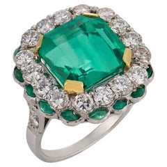 Art Deco style GIA 6.16 carat emerald diamond platinum cluster ring