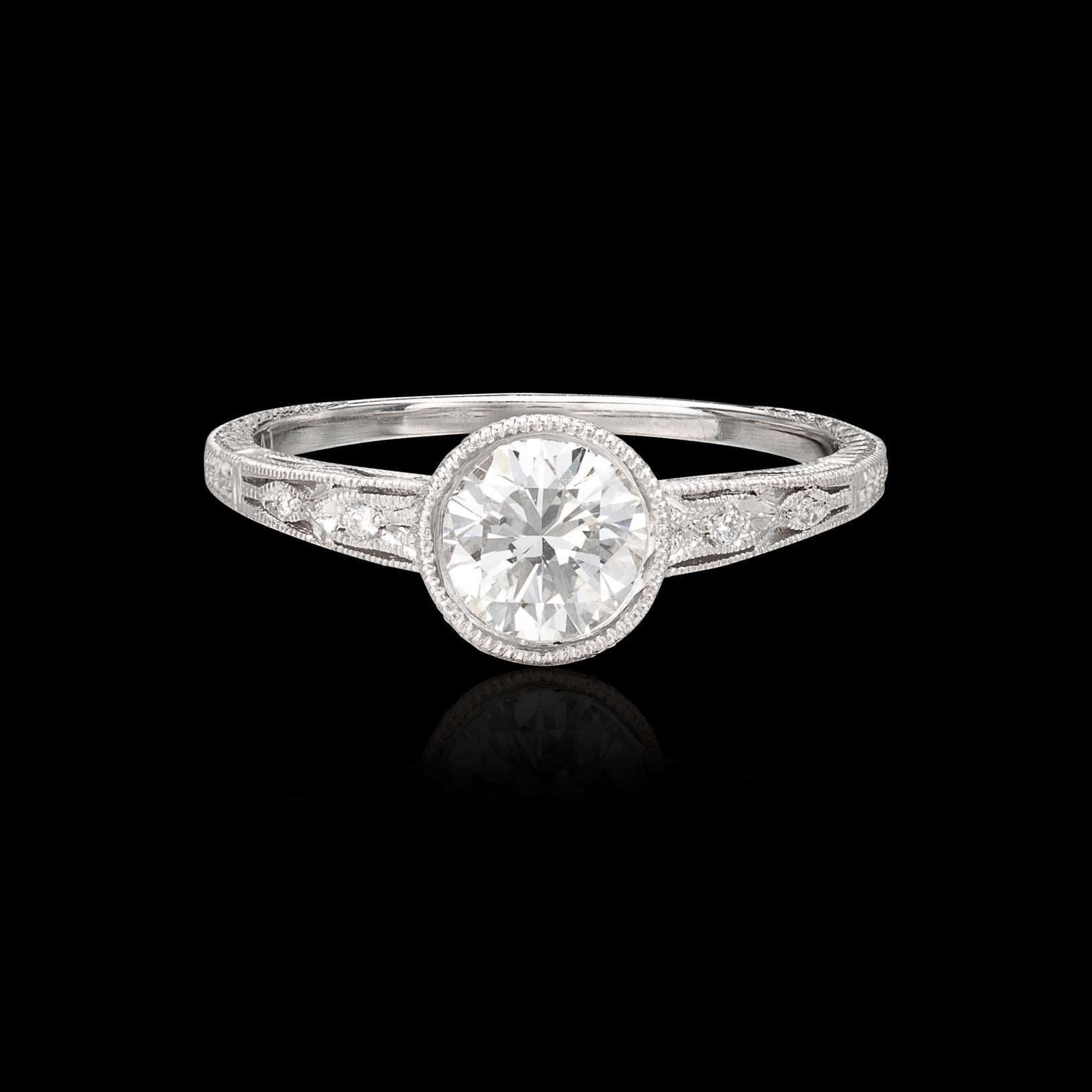 Where classic Art Deco design meets modern craftsmanship. This platinum stunner features a 0.93 carat round brilliant cut diamond expertly bezel set to showcase its beautiful GIA F/SI1 grade. This stunning ring is accented with gorgeous milgrain and