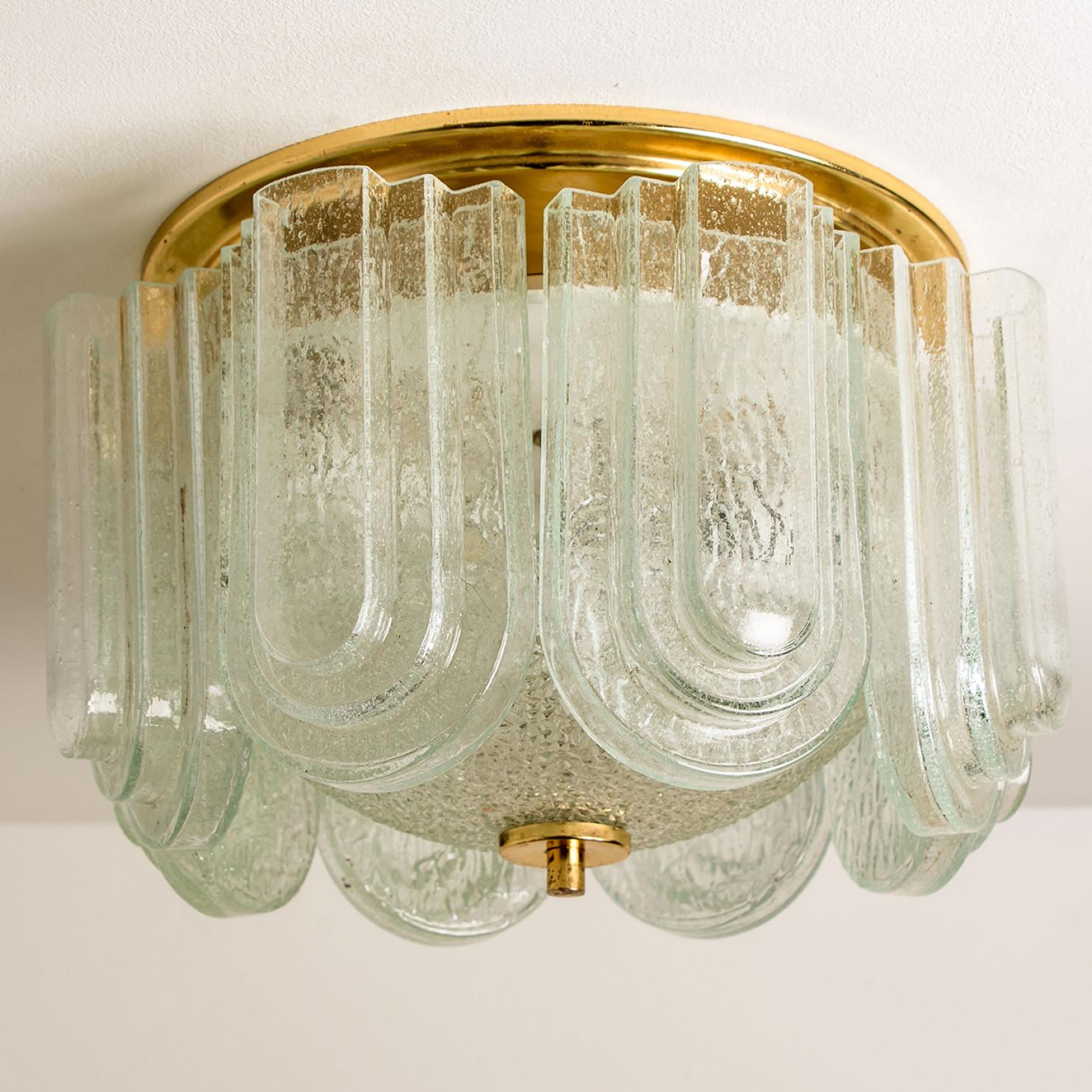 Brass and molted glass flush mount from the 1960s of the Doria Leuchten company in Germany, Europe. The lamp has beautiful stepped layers (Art Deco style) of glass construction and a brass finish. High quality piece. True craftsmanship of the 20th