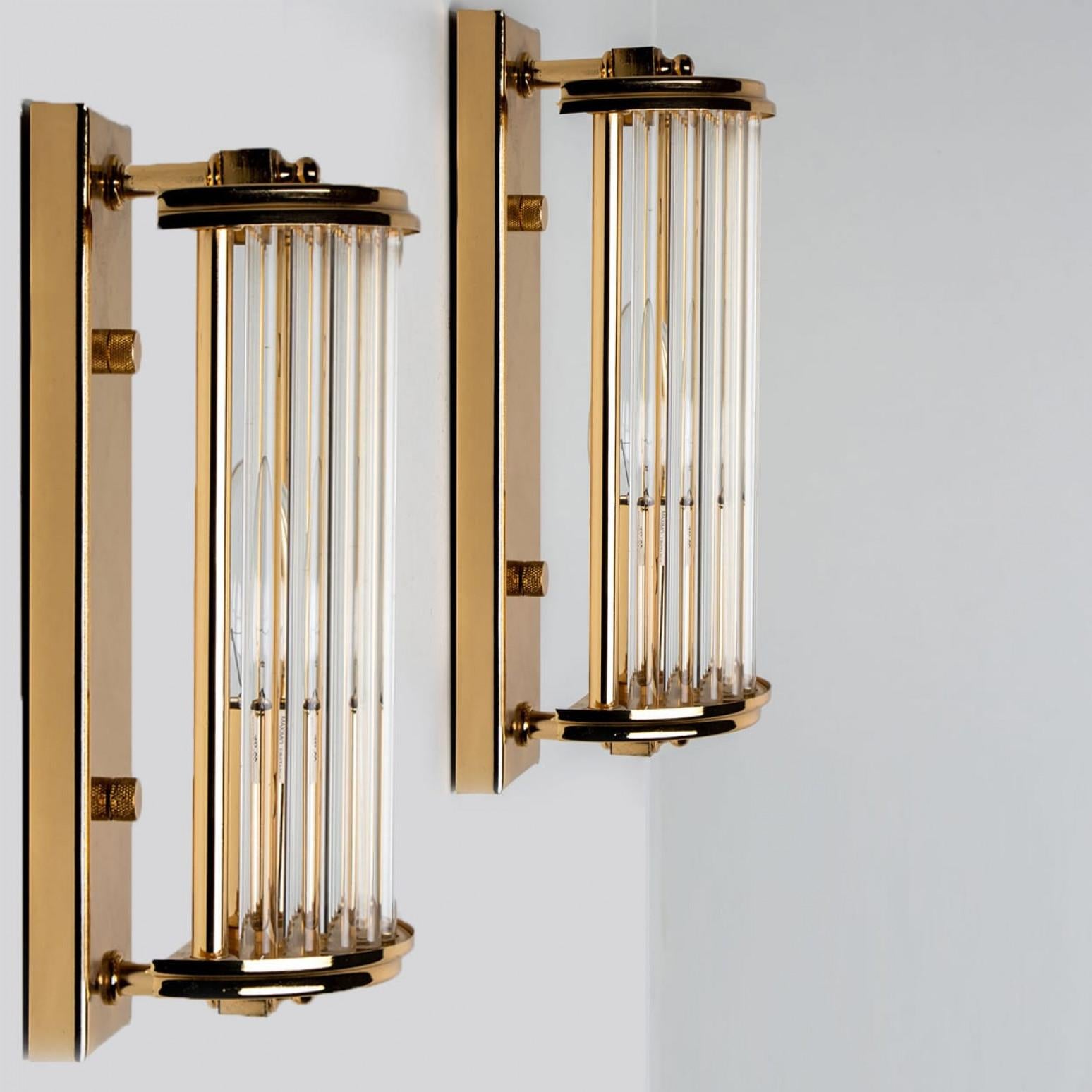 Art deco style brass and glass wall lights. Manufactured in Italy around 1970.
With their clean modernist lines and beautiful attention to detail, these sconces would be a winning addition to any style of interior from classical decoration to