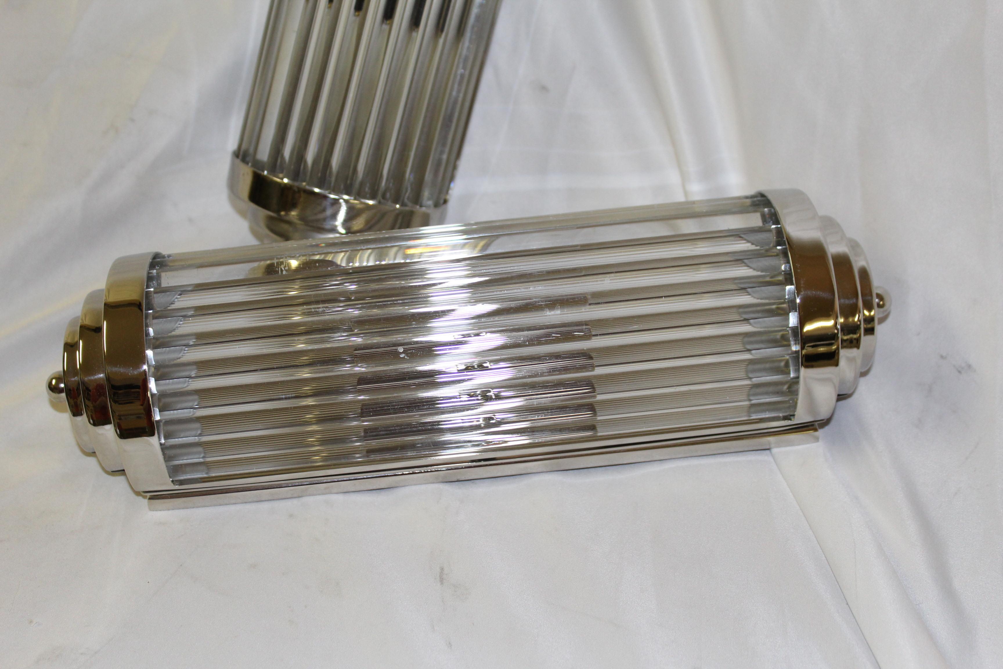 Hi polished nickel finish deco sconces, all glass rods handcut individually to fit. Has a double candelabra socket assembly with nickel cover. Can mount either vertically or horizontally. A great looking deco sconce. Measures:  12