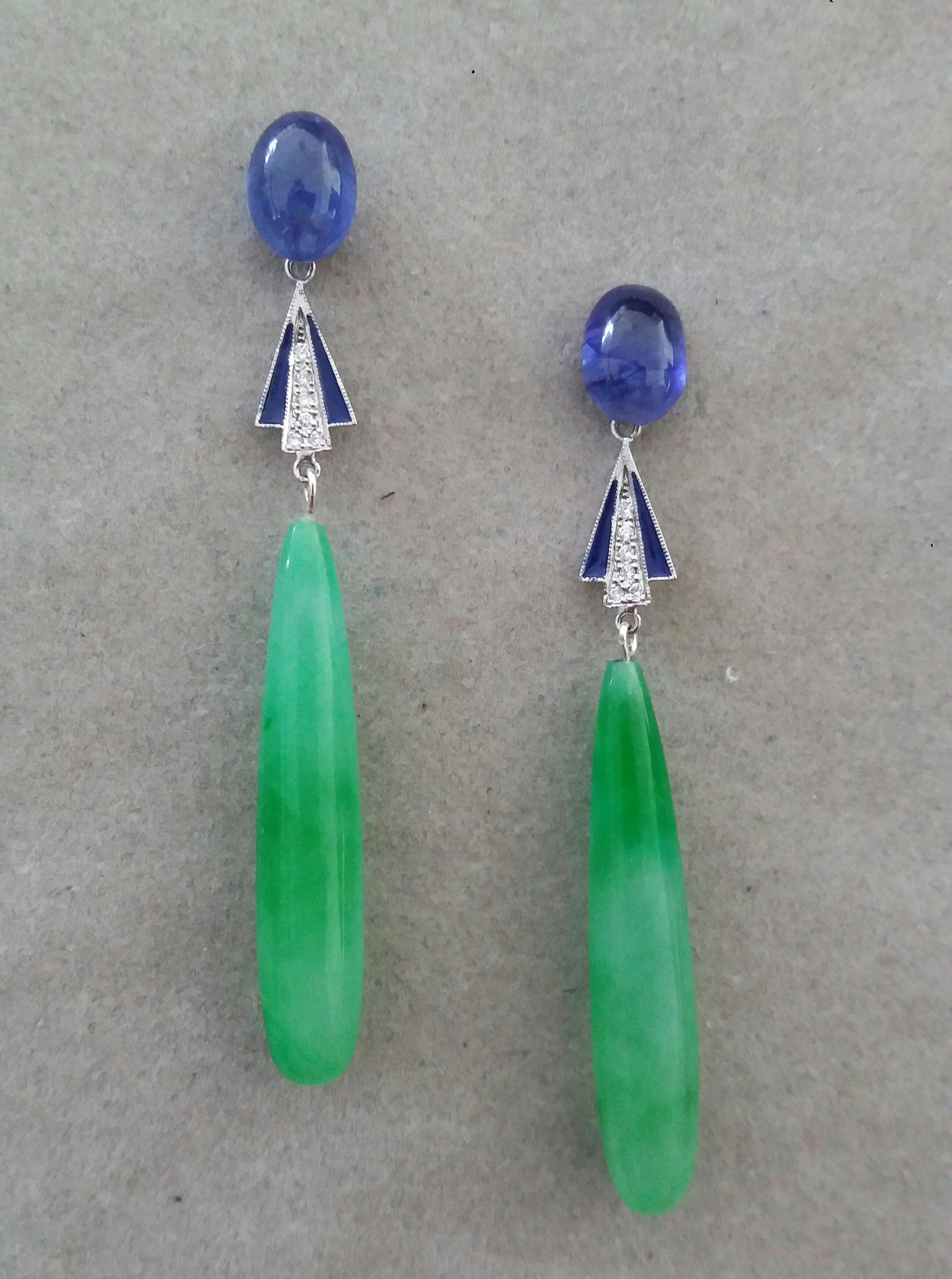 In these Classic Art Deco style earrings we have 2 very good quality Natural Thai Blue Sapphire cabochons measuring 8 x 10 mm. as  tops, middle parts are in white gold ,12 round full cut diamonds and blue enamel,while in the lower parts there are 2