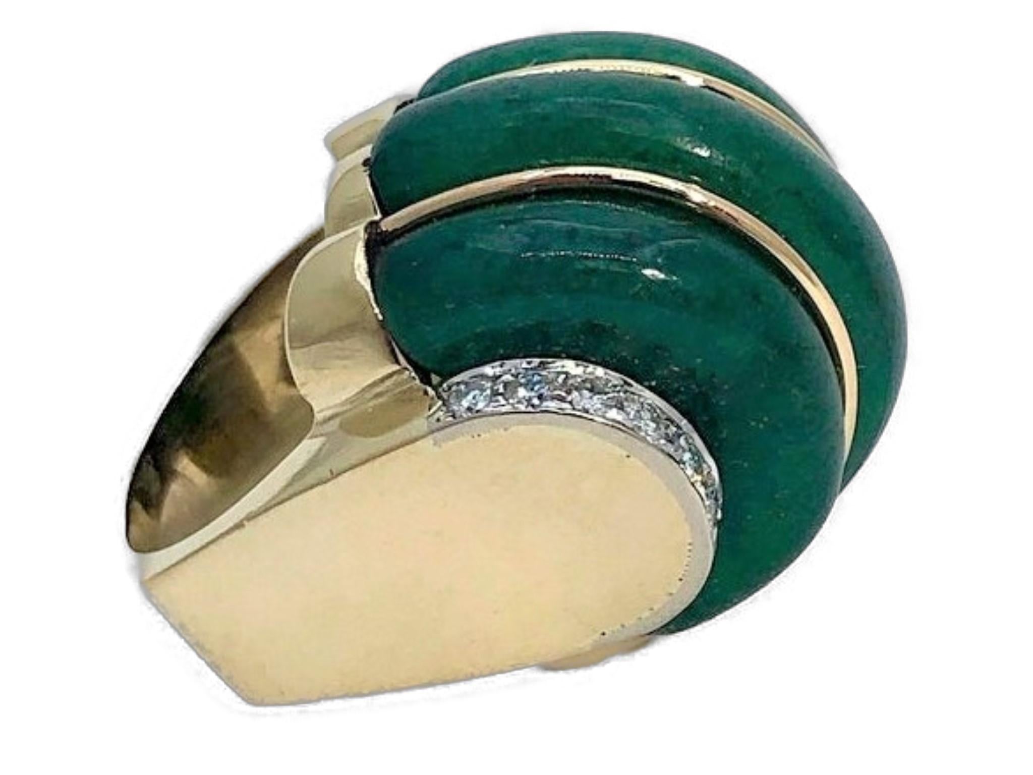 This imaginative and striking Art Deco style cocktail ring is set with a large, three section aventurine dome delineated by narrow gold strips. The high shoulders are set with eighteen brilliant cut diamonds weighing an approximate total of 1.00ct