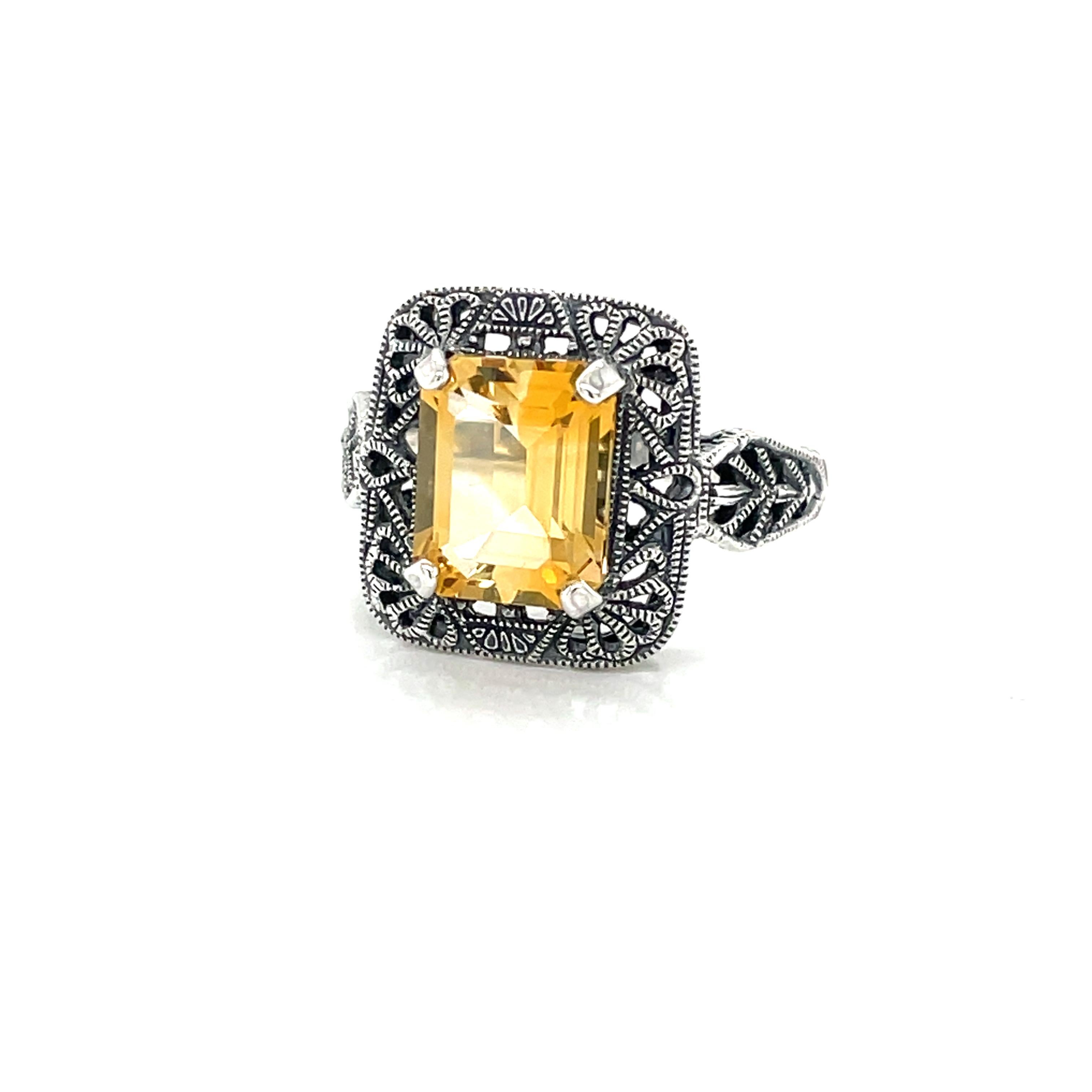 A lovely two carat emerald-cut Citrine (9.7 x7.6mm) is featured in this Art Deco Style Sterling Silver Filigree Ring. 
In size 8. New and presented in miniature antique style gift box. 
