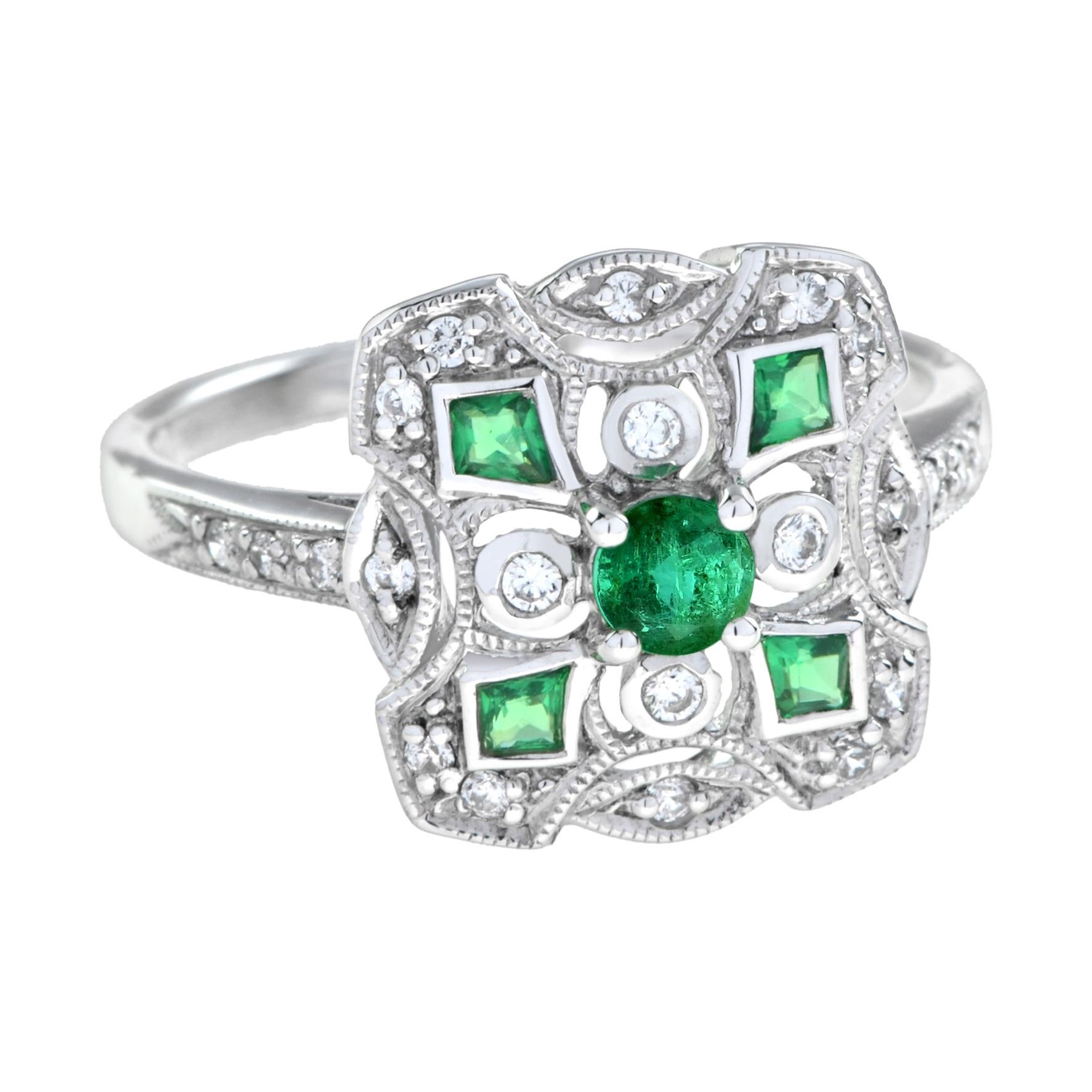 Art Deco style emerald and diamond square cluster ring. Centrally set with round emerald in a prong setting, set to corners with emeralds in millgrain setting and further enhanced with round cut diamonds. 14K White Gold. 
Ring Information
Style: Art