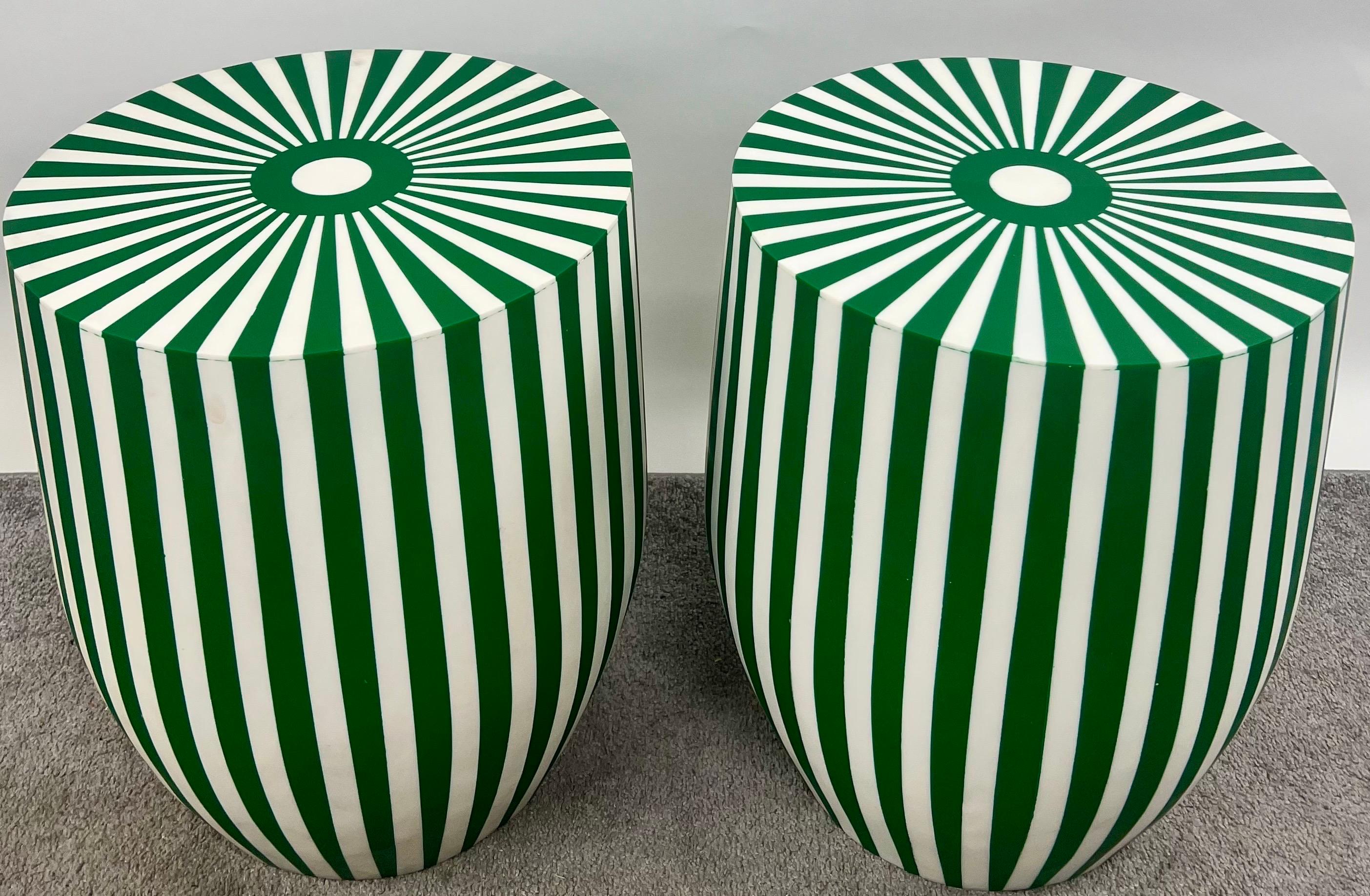 A Pair of Art Deco Style Green & White Cylindrical Resin Side, End Tables or Stools with stripped patterns : 

This exquisite pair of Art Deco-inspired side tables or stools embodies a striking fusion of geometric precision and bold contrast.