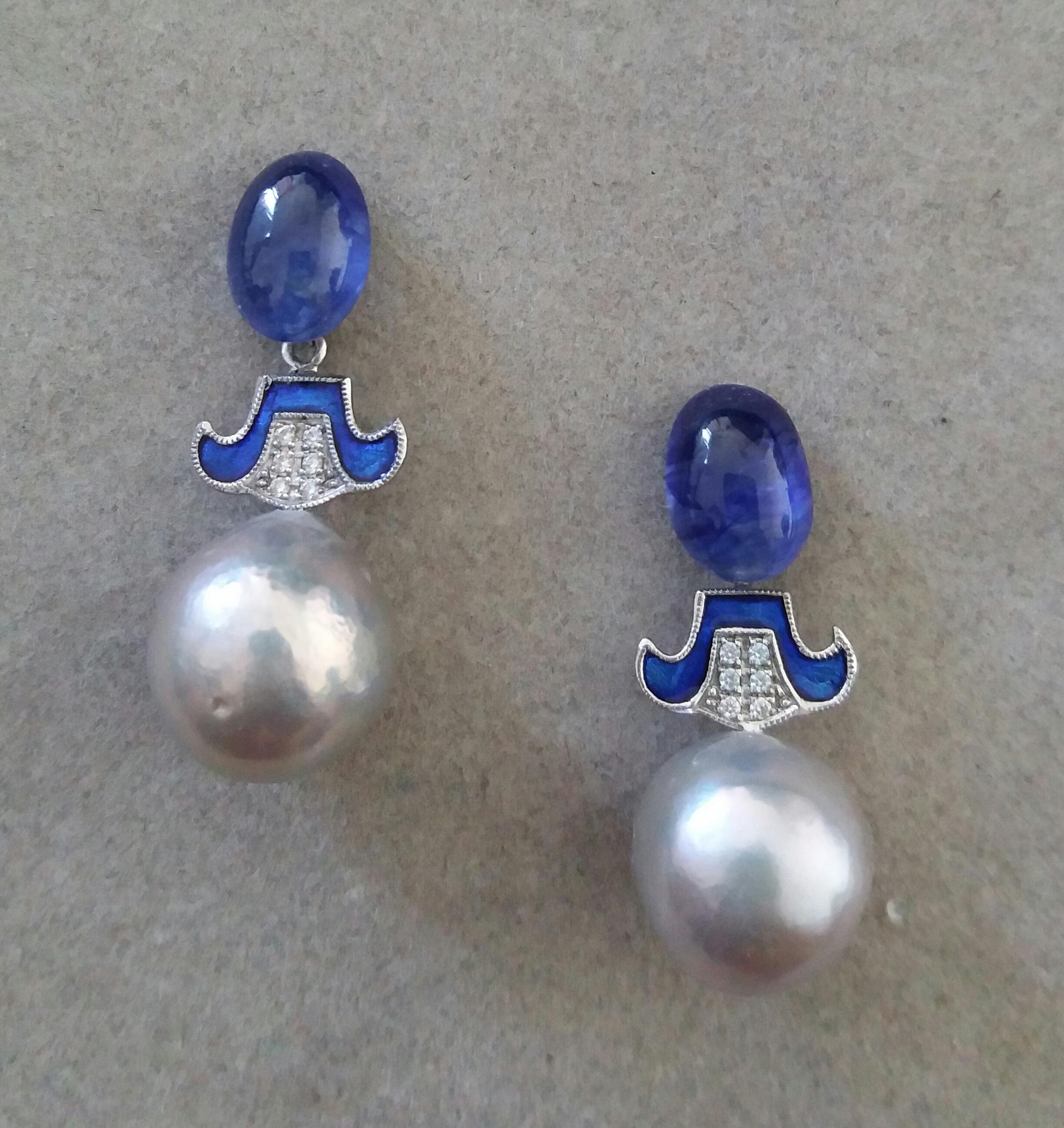 2  Blue Sapphire oval cabs 7,5 x 10 mm. are the upper parts, then the central parts are in white gold,12 round full cut  diamonds and Blue Enamel, the lower parts are composed of 2 Grey Baroque pearls with a diameter of 12 mm each.

In 1978 our