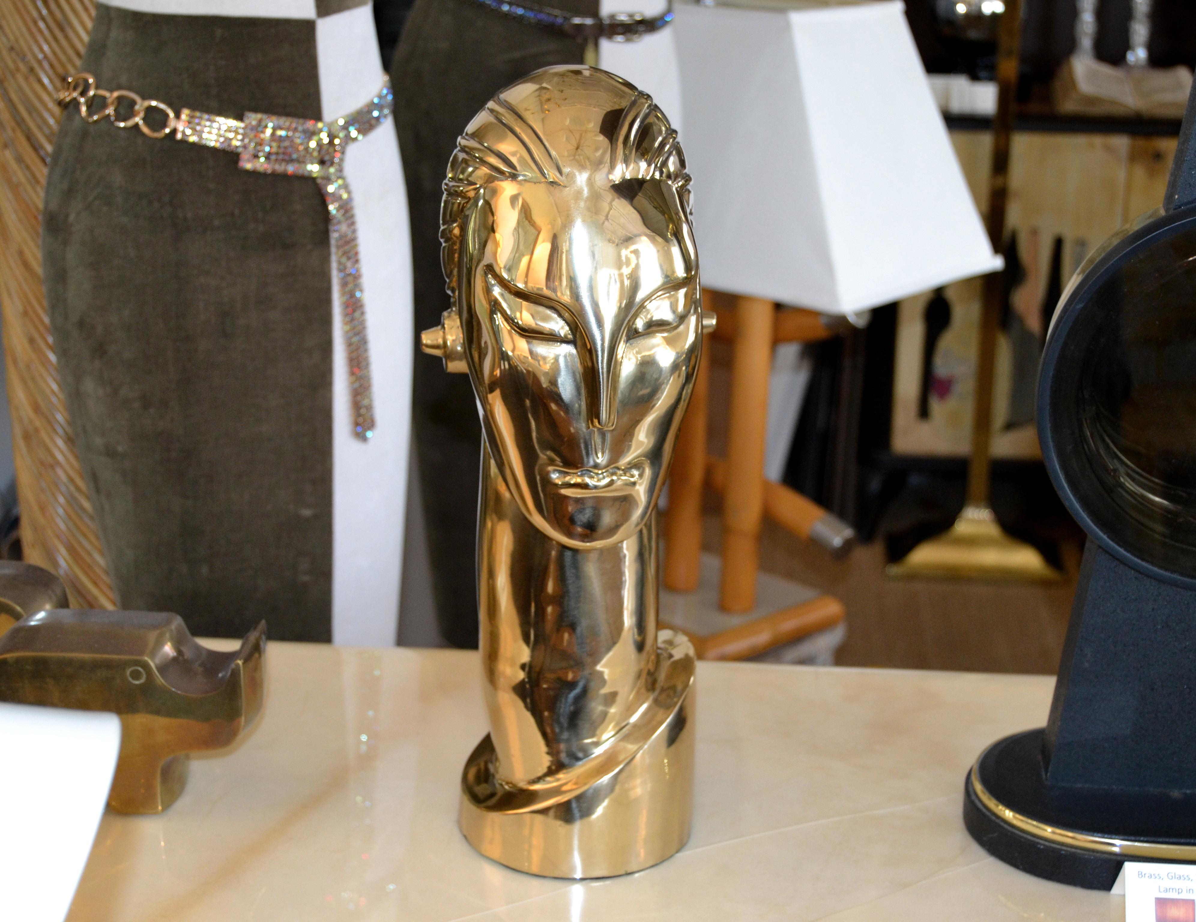 Art Deco Style Manner of Franz Hagenauer Bronze Bust with Elongated Neck.
Figurative Sculpture depicting the head of a figure with elongated neck and pegged ear adornments. Comes with a green felt cover underneath to protect Your furniture.
No