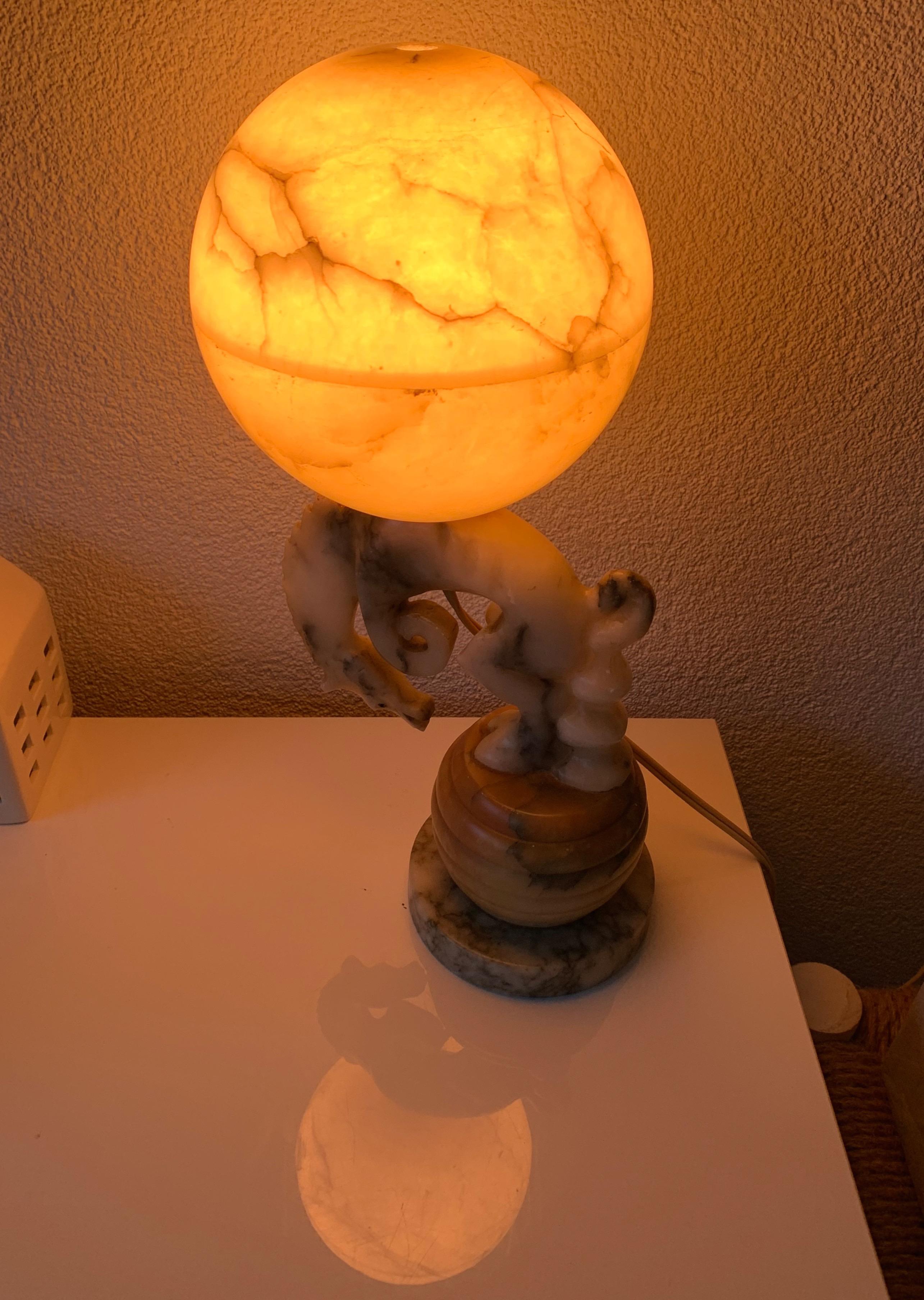 Stylized and finest quality carved, bronco horse table lamp.

All handcrafted out of natural materials only, this rare bucking horse table lamp is a marvelous work of art in the daytime and a stunning and spherical light fixture in the evenings.