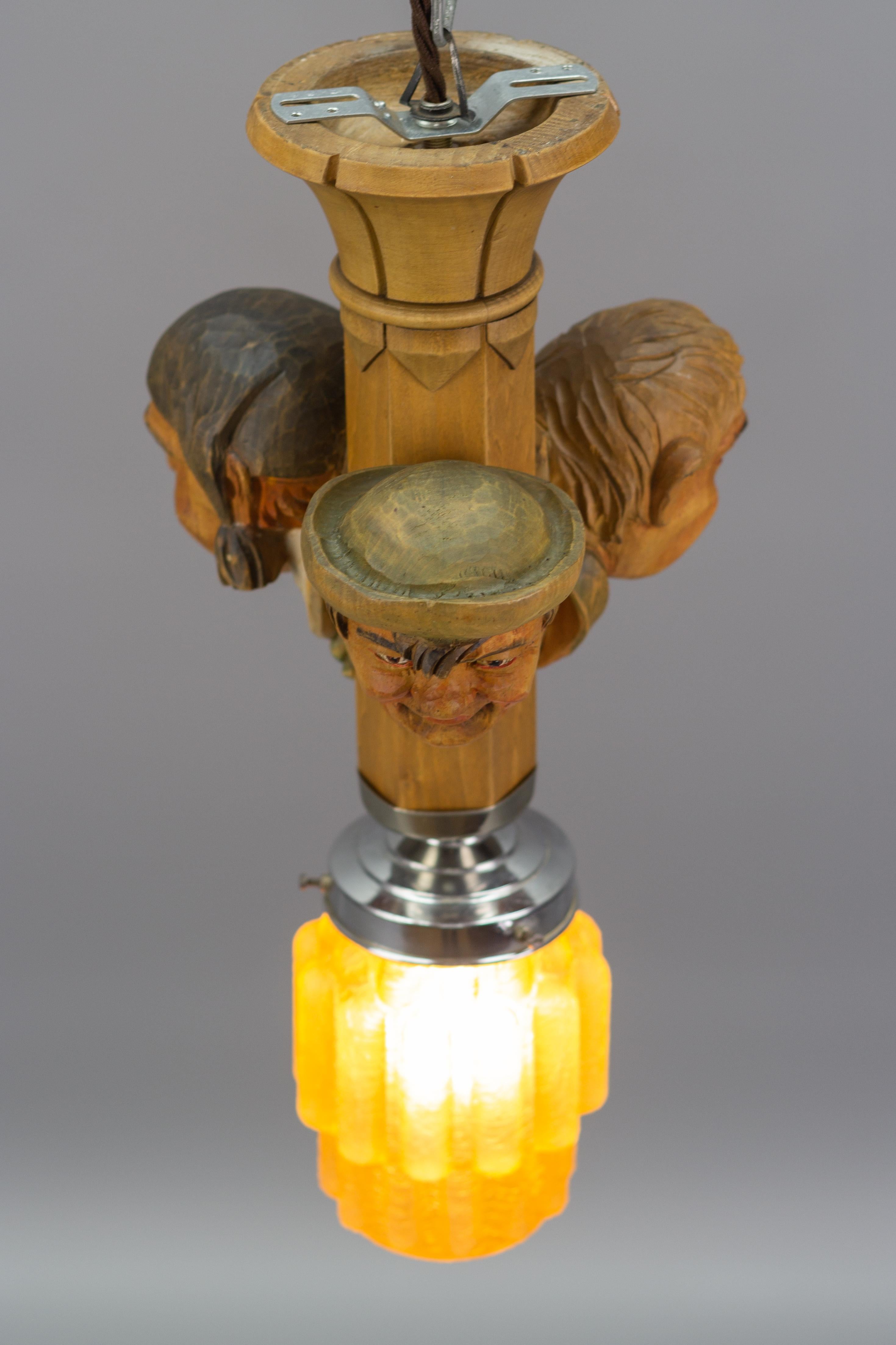 Art Deco Style Hand-Carved Wooden and Crackle Glass Pendant Light Three Men  For Sale 10