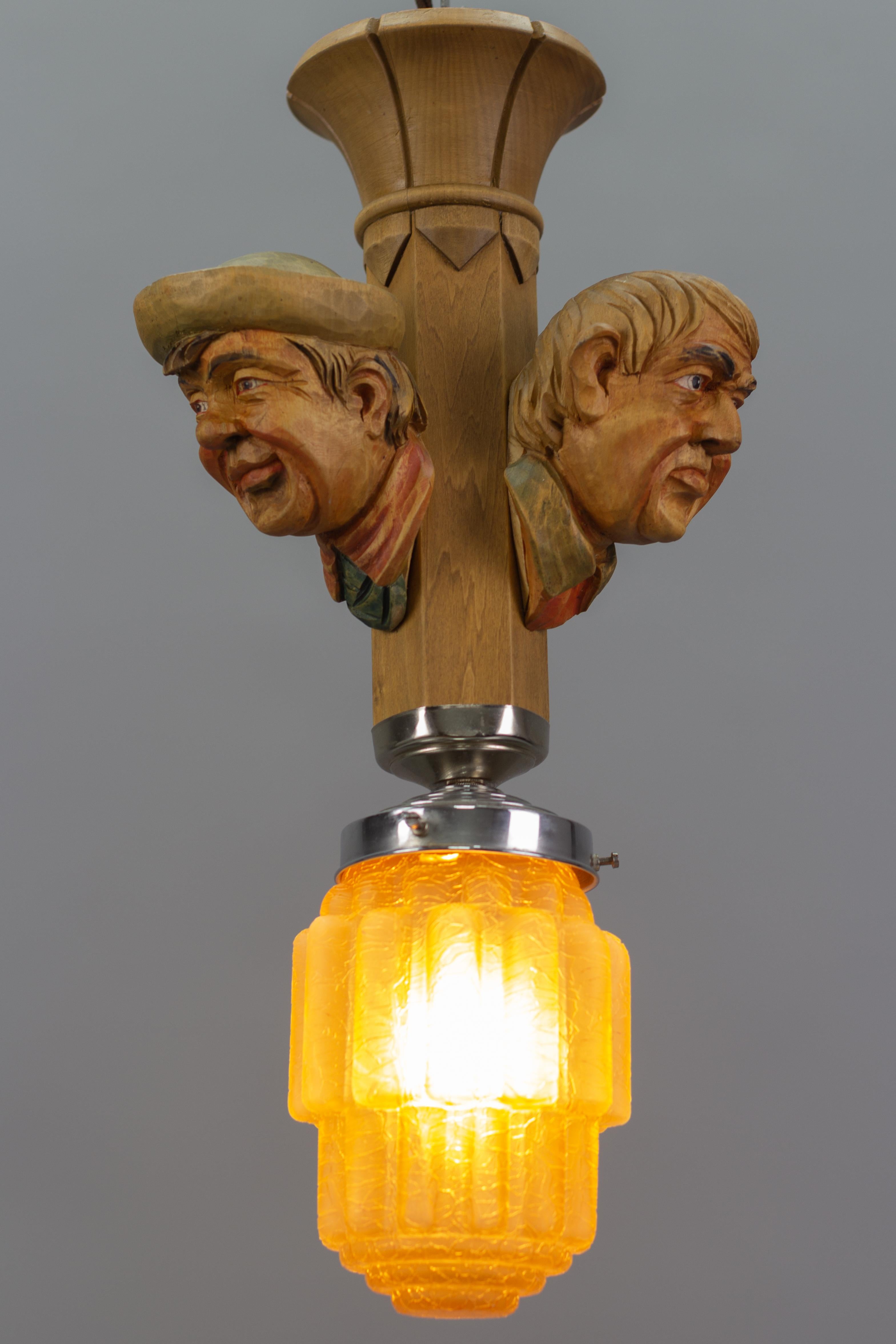 Art Deco Style Hand-Carved Wooden and Crackle Glass Pendant Light Three Men  For Sale 11