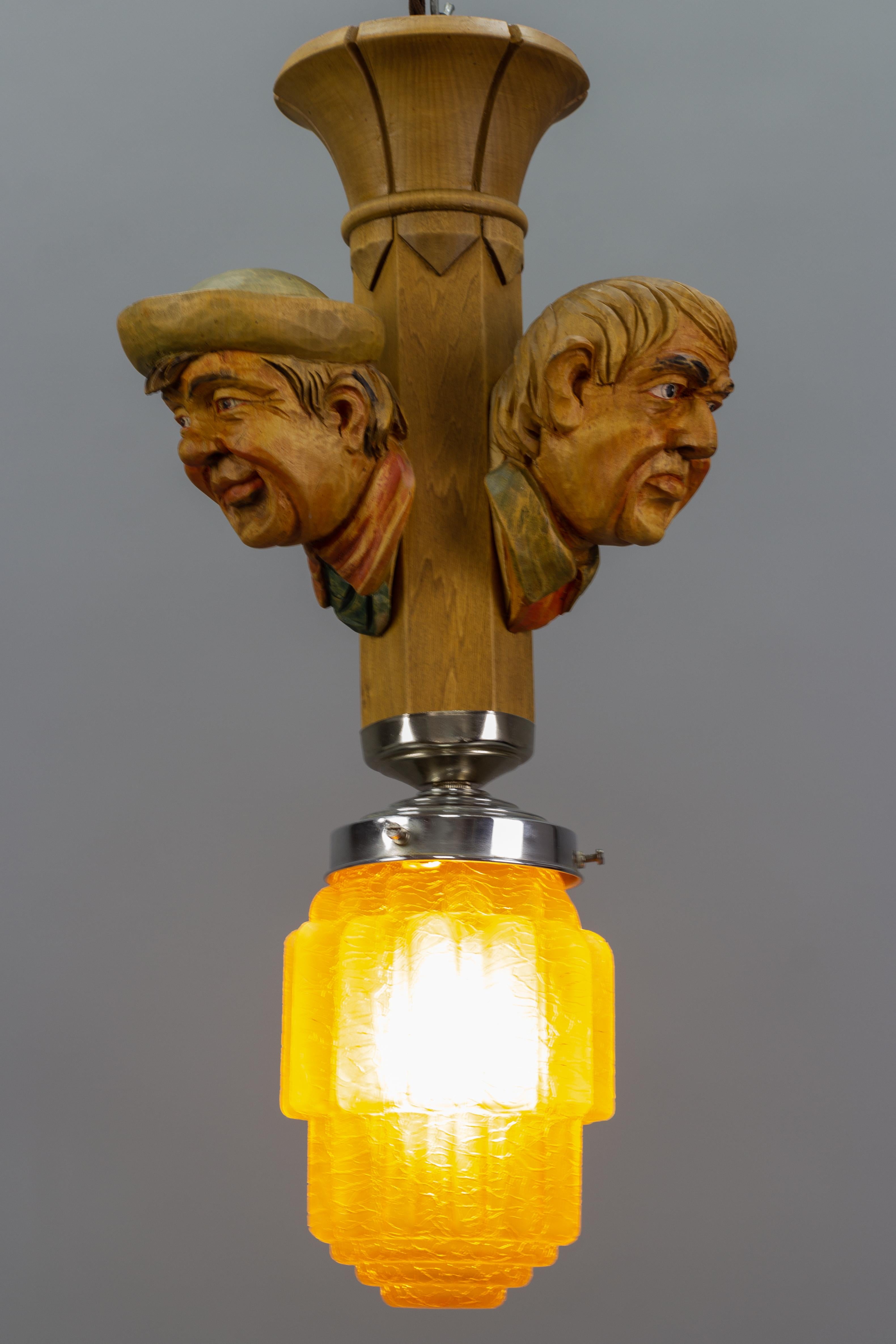 Art Deco Style Hand-Carved Wooden and Crackle Glass Pendant Light Three Men  For Sale 2
