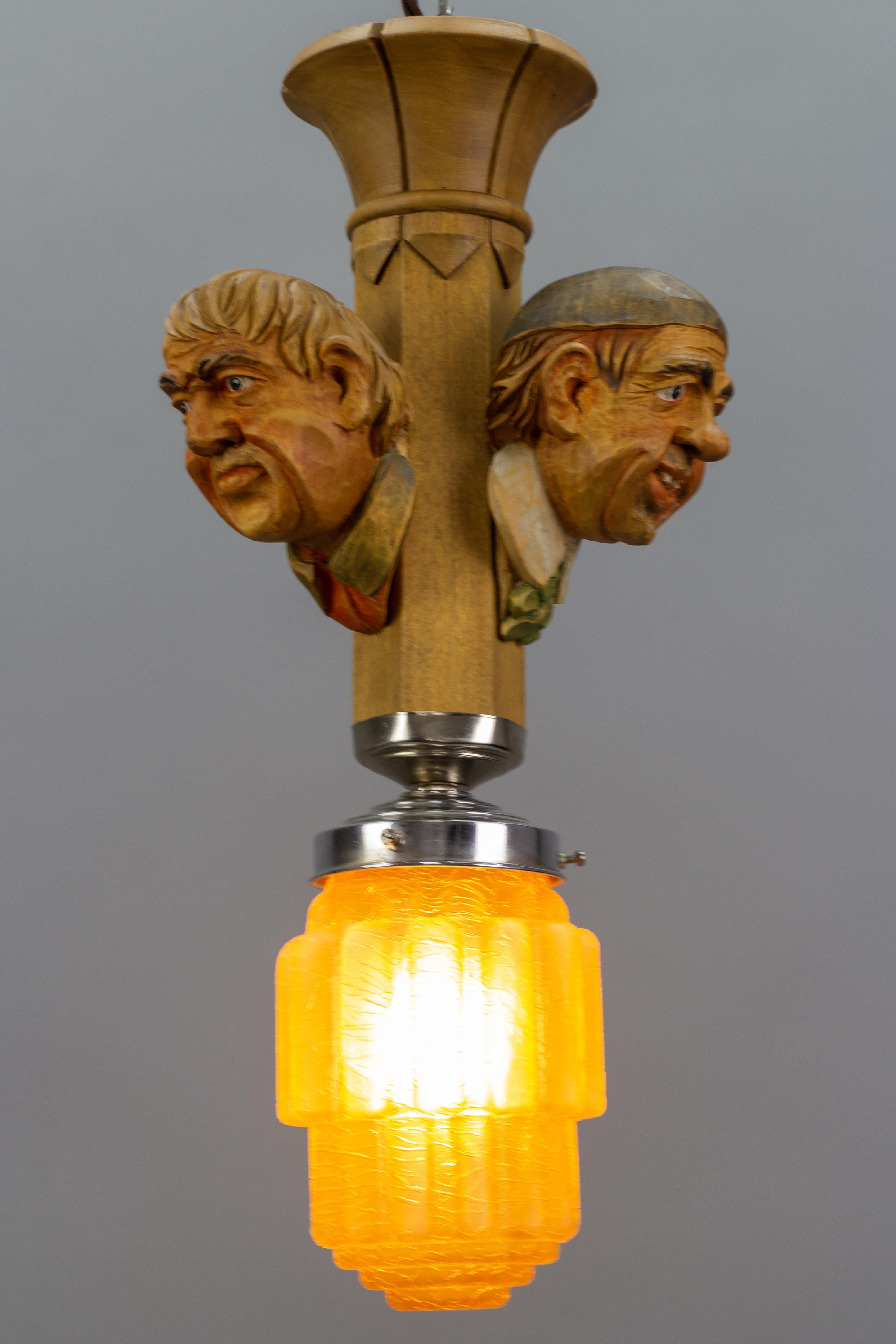 Art Deco Style Hand-Carved Wooden and Crackle Glass Pendant Light Three Men  For Sale 3