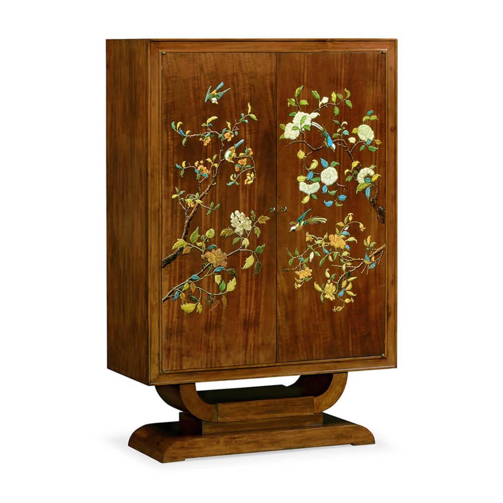 A French Art Deco-inspired mahogany two-door cabinet hand painted with scenes blossoms and hummingbirds, the fitted interior lined with four shelves and two lower drawers, above a U form pedestal stepped base. 

Dimensions: 44