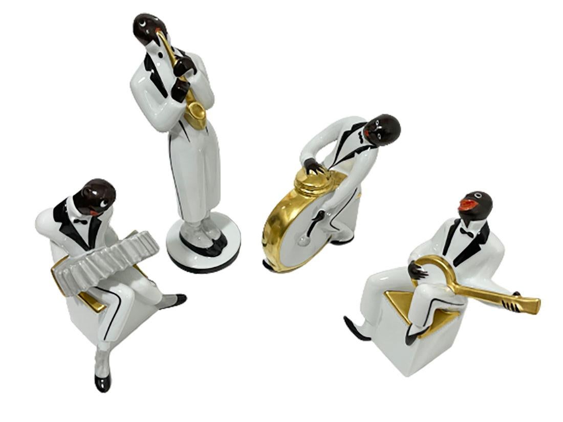 Art Deco style hand painted ceramic set of a band, Colection Robj by Villeroy & Boch
 
This serie was first created in the late 1920s by Robj. This set was made by Villeroy & Boch in the late 20th century. The set consists of 4 Jazz band figures.