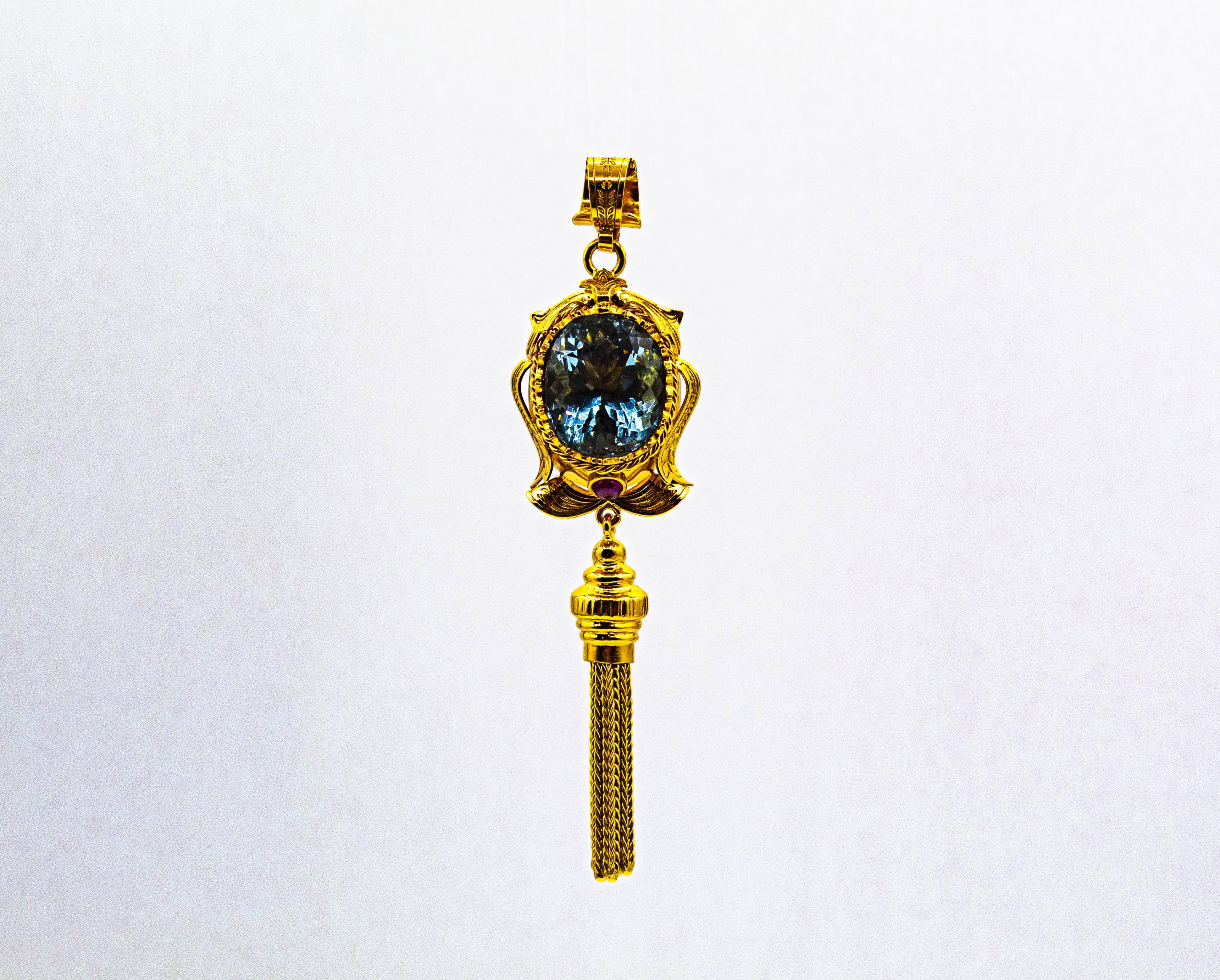 This Pendant is made of 9K Yellow Gold.
This Pendant has a 0.30 Carats Cabochon Cut Rubies.
This Pendant has a 8.00 Carats Blue Topaz.

We're a workshop so every piece is handmade, customizable and resizable.
