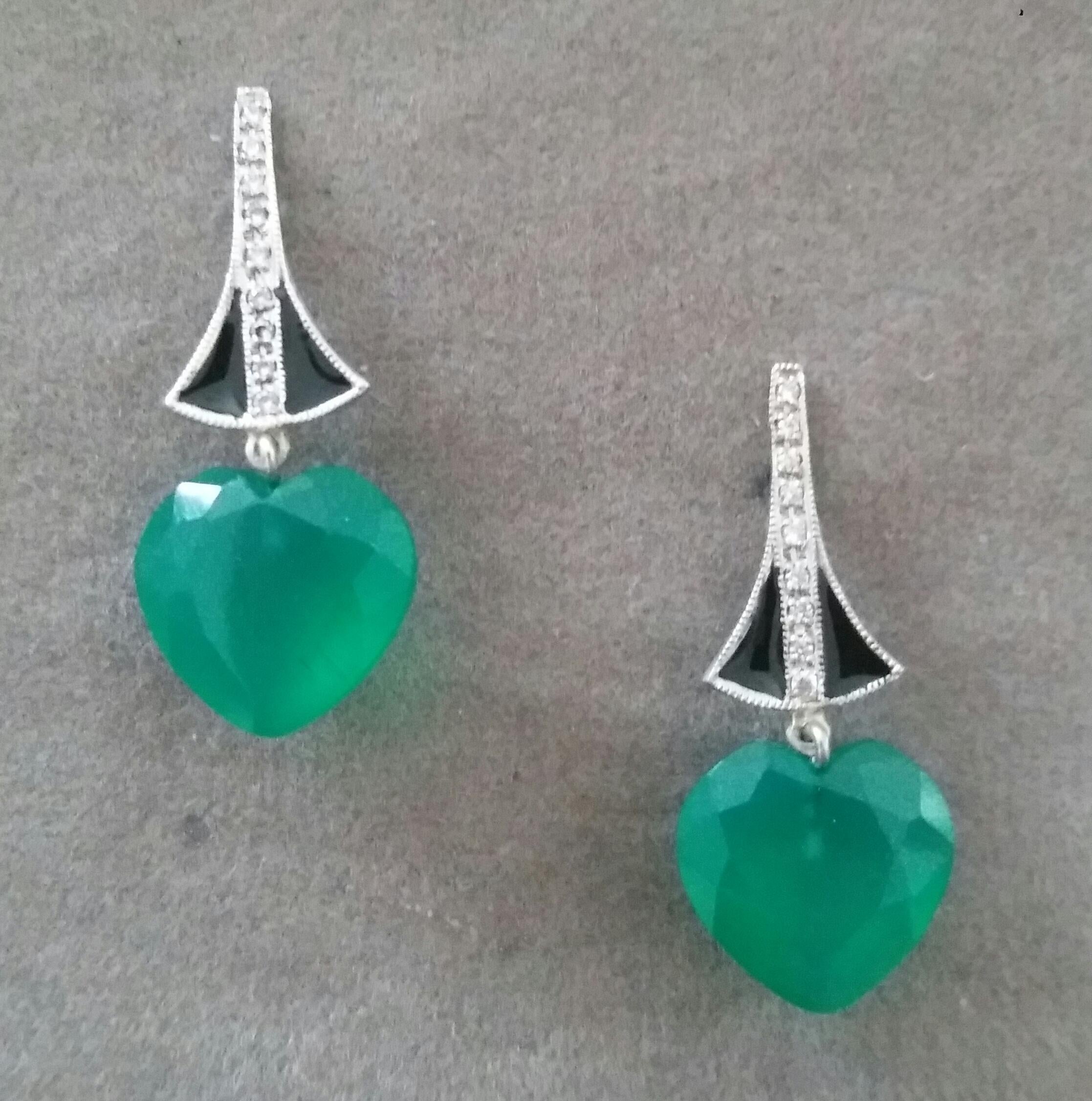 In these classic Art Deco Style earrings the tops are 2 elements  in 14 kt. white gold, 18 round full cut diamonds and black enamel ,in the lower parts we have 2 Heart Shape Faceted Green Onyx  measuring 10 x 12 mm 

In 1978 our workshop started in