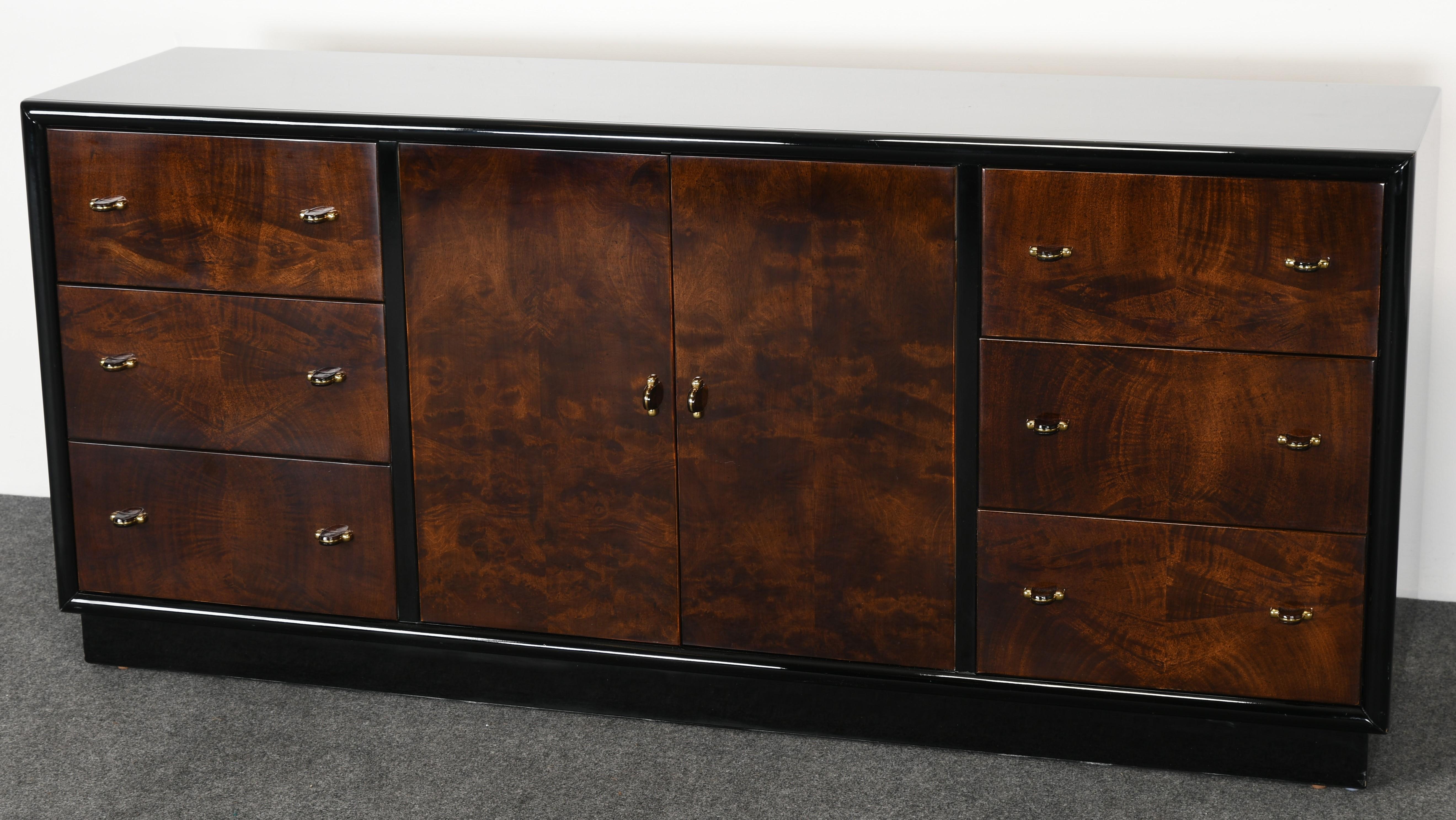 A fabulous Art Deco style credenza by Henredon scene three furniture line. This black lacquered credenza is the perfect size for an apartment or home. Labeled 
