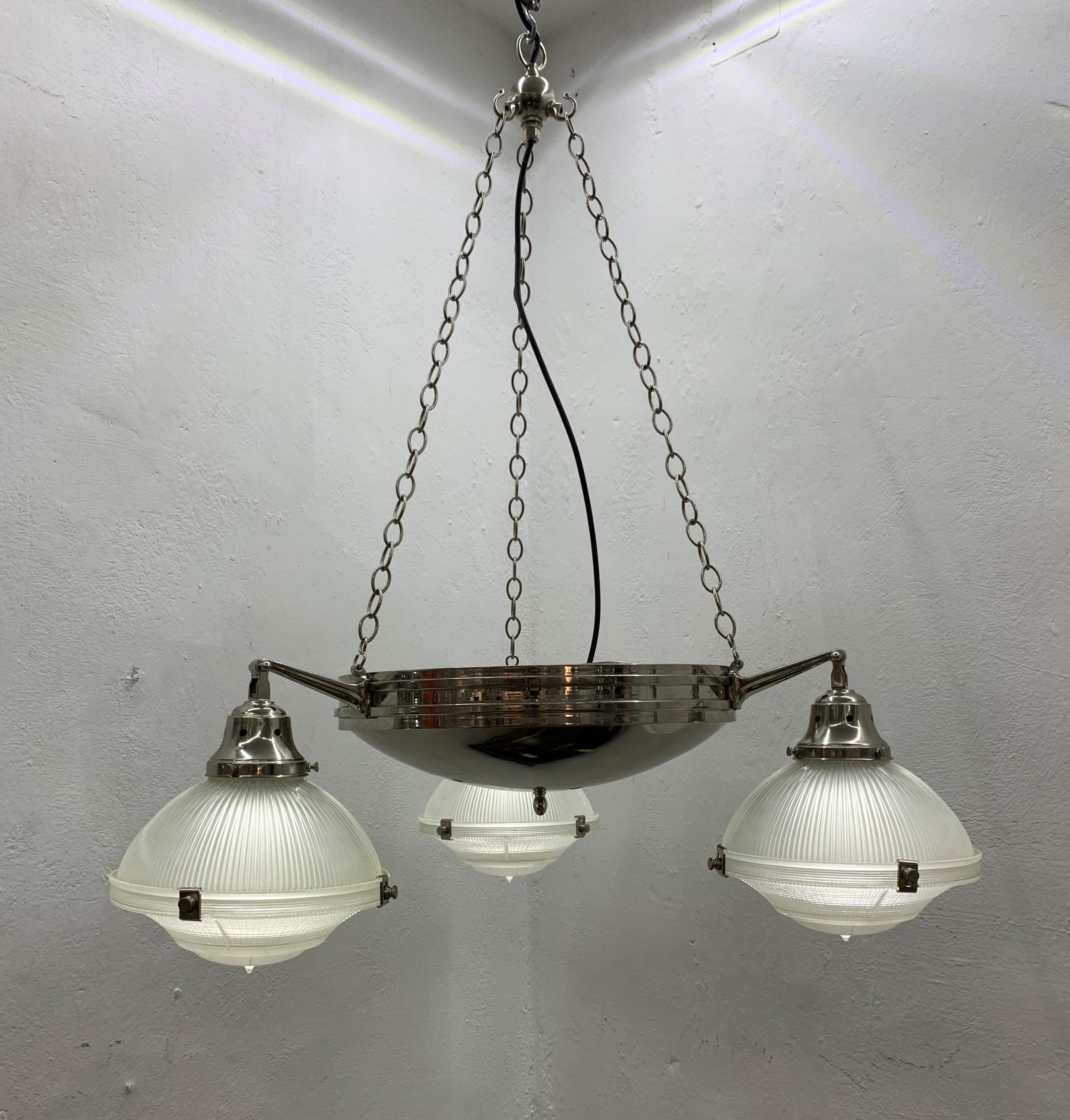 Beautiful 3-light chandelier manufactured in nickel plated brass and pressed glass.
Each pressed glass shade consists of 3 separate pieces.
Stamped with patent number and 