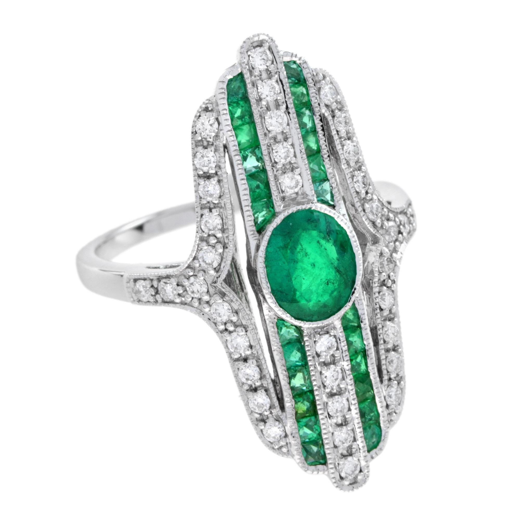 Simply beautiful and finely detailed cocktail ring center securely set with an oval emerald accented by French cut emerald and diamond. The perfect accessory for the modern woman! Ready to wear from day to evening with style and