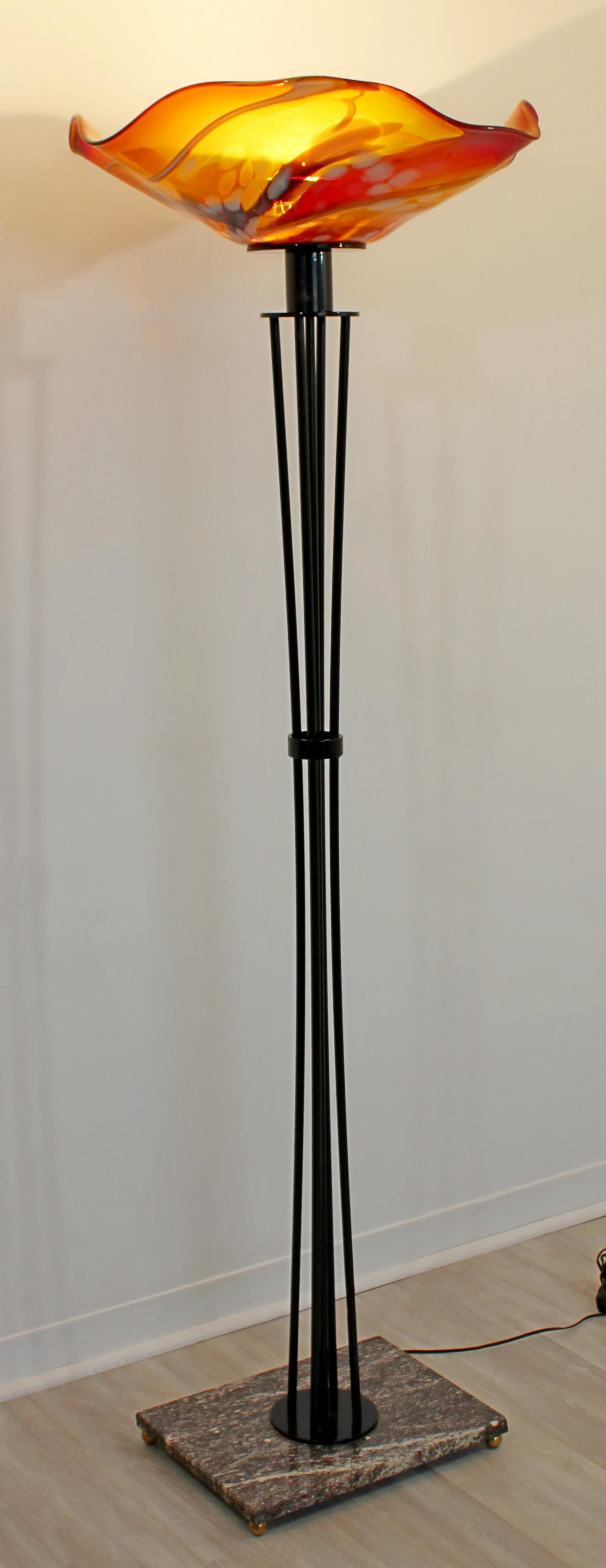 For your consideration is a stunningly beautiful, wrought iron and orange blown glass floor lamp on a marble base. In excellent condition. The dimensions are 26