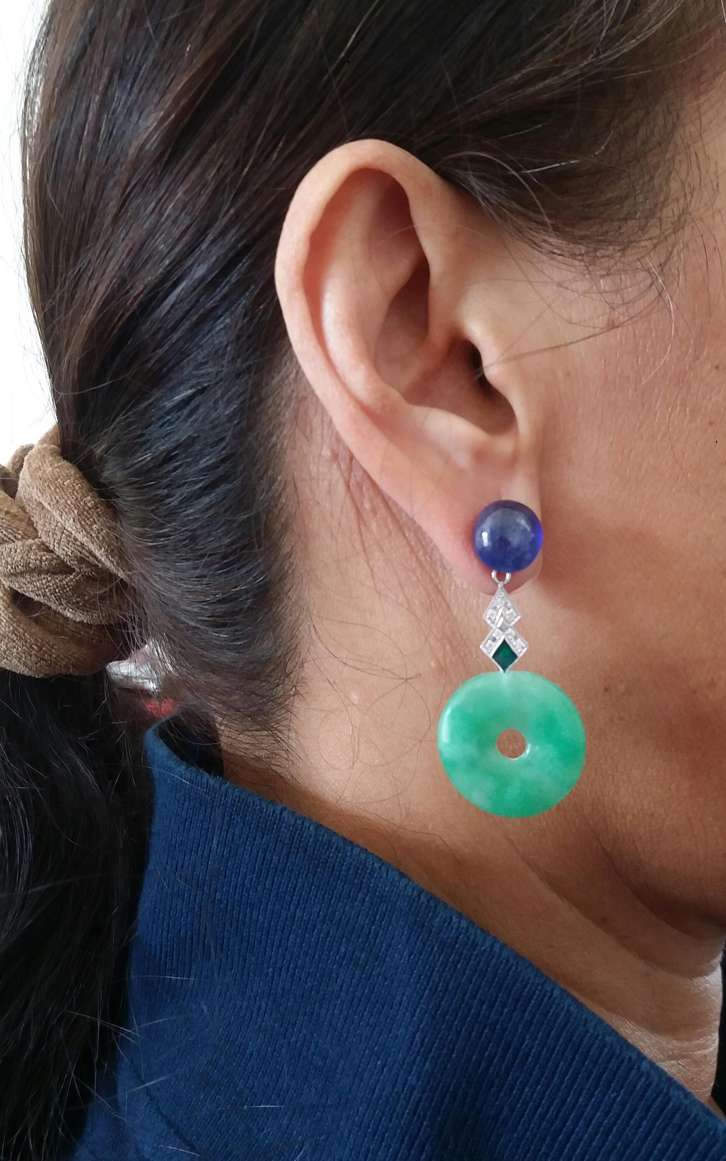2 large oval Blue Sapphire cabochons  are the upper part of these earrings, the middle part is made up of 2 elements in white gold, diamonds and green enamel while at the bottom we have 2 Jade Donuts
In 1978 our workshop started in Italy to make