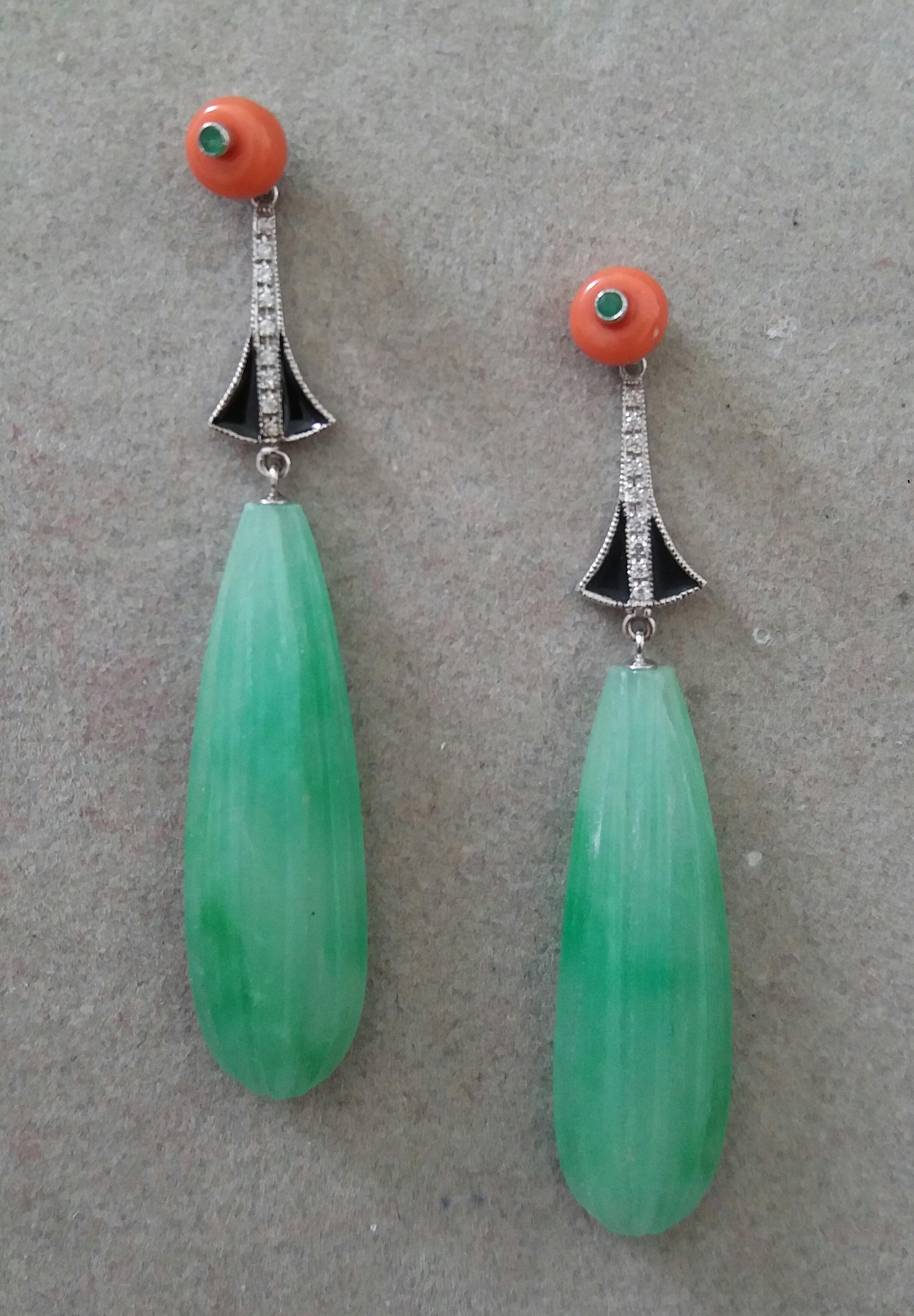 In these classic Art Deco Style earrings the tops are 2 round orange mediterranean coral buttons with small round Emeralds in the center,middle parts in 14 kt white gold,18 full cut round diamonds and black enamel,bottom parts are 2  Burma Jade