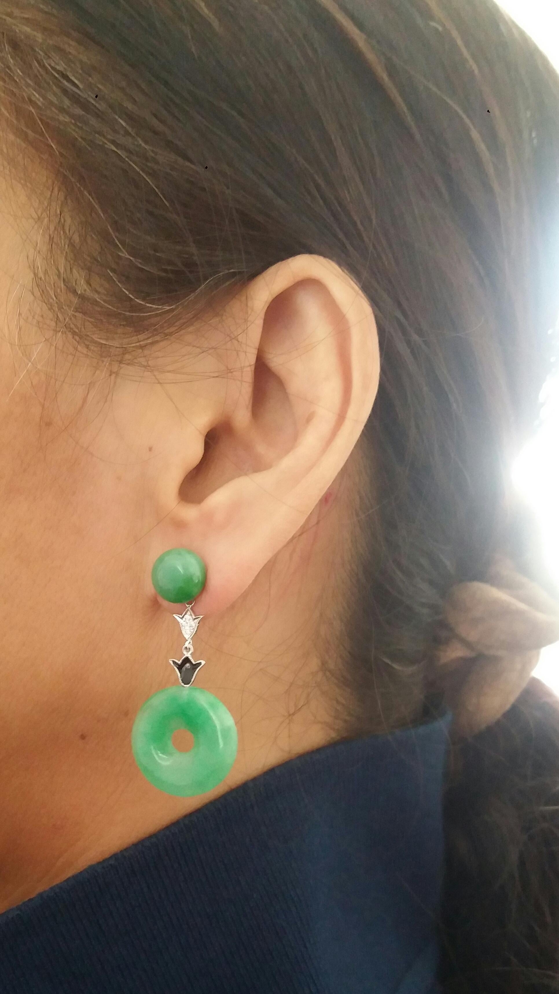 2 round Jade cabochons are the upper part of these earrings, the middle part is made up of 2 flower shape elements in white gold, diamonds and black enamel while at the bottom we have 2 Jade Donuts
In 1978 our workshop started in Italy to make
