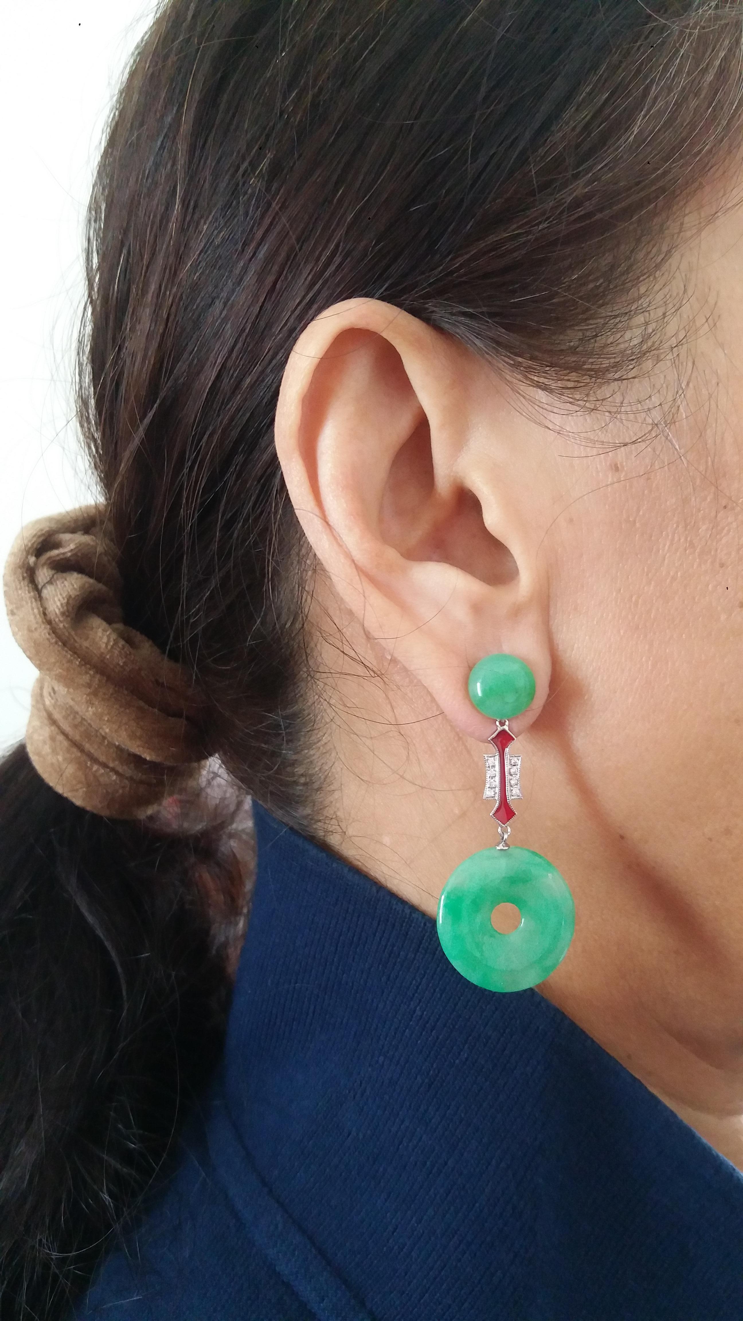 We have 2 round jade buttons on top , the central part are composed by 2 elements in gold , diamonds and  red enamel , in the bottom part we have 2 jade Donuts
In 1978 our workshop started in Italy to make simple-chic Art Deco style jewellery,