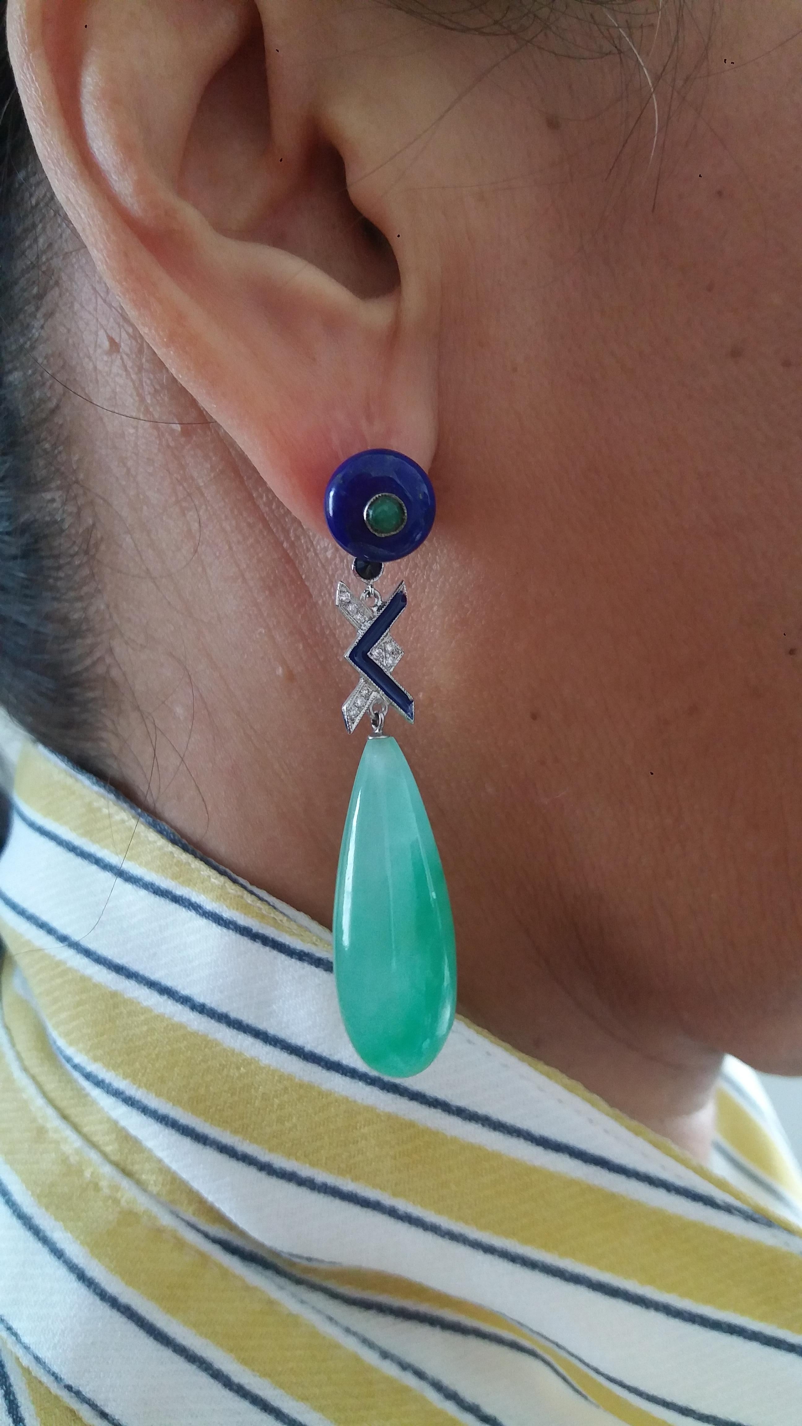 Tops are 2 round Lapis Lazuli buttons with small round emerald cabs in the center,middle part in White Gold Small Full Cut Diamonds and Blue Enamel,bottom parts are 2 big Jade round drops
In 1978 our workshop started in Italy to make simple-chic Art