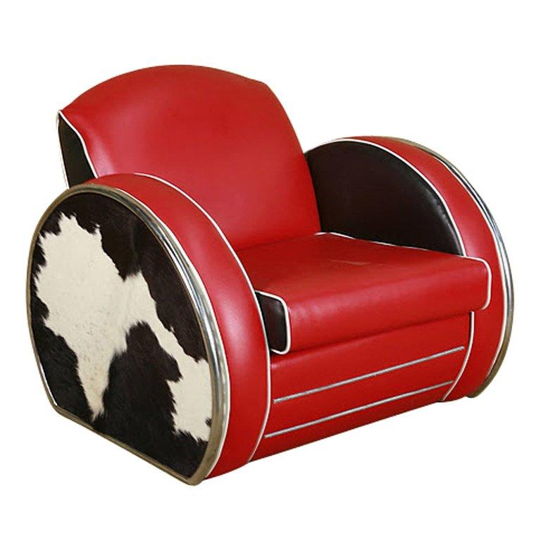 This Art Deco style jazz club chair in the manner of Donald Deskey boasts dramatic red vinyl upholstery with chrome trim detail and inset cowhide sides.
 This is my Christmas Sale Price for you
Harveys Formally known as 20th Century Props