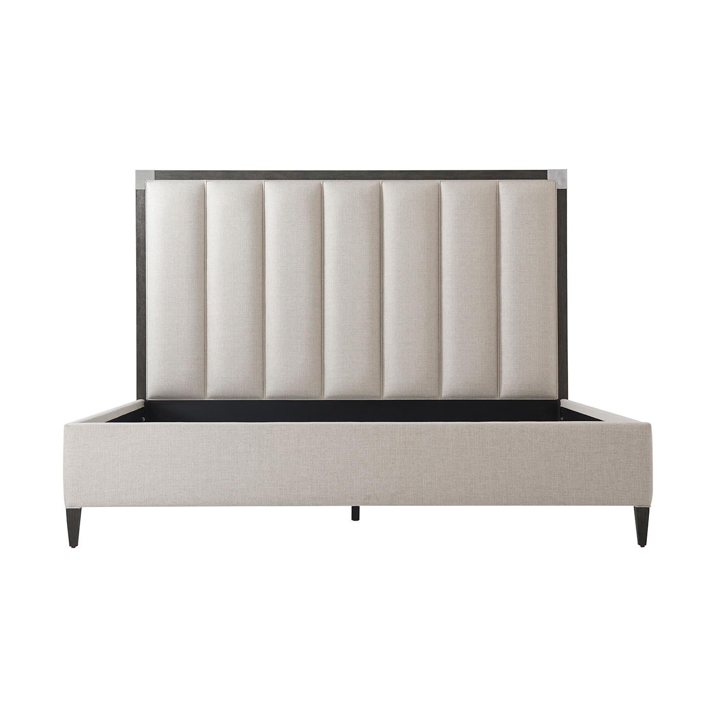 Art Deco Style bed with our Anise finish frame and brushed nickel finish corner mounts with a vertically channeled upholstered headboard, upholstered rails and raised on tapered legs.
Dimensions: 81