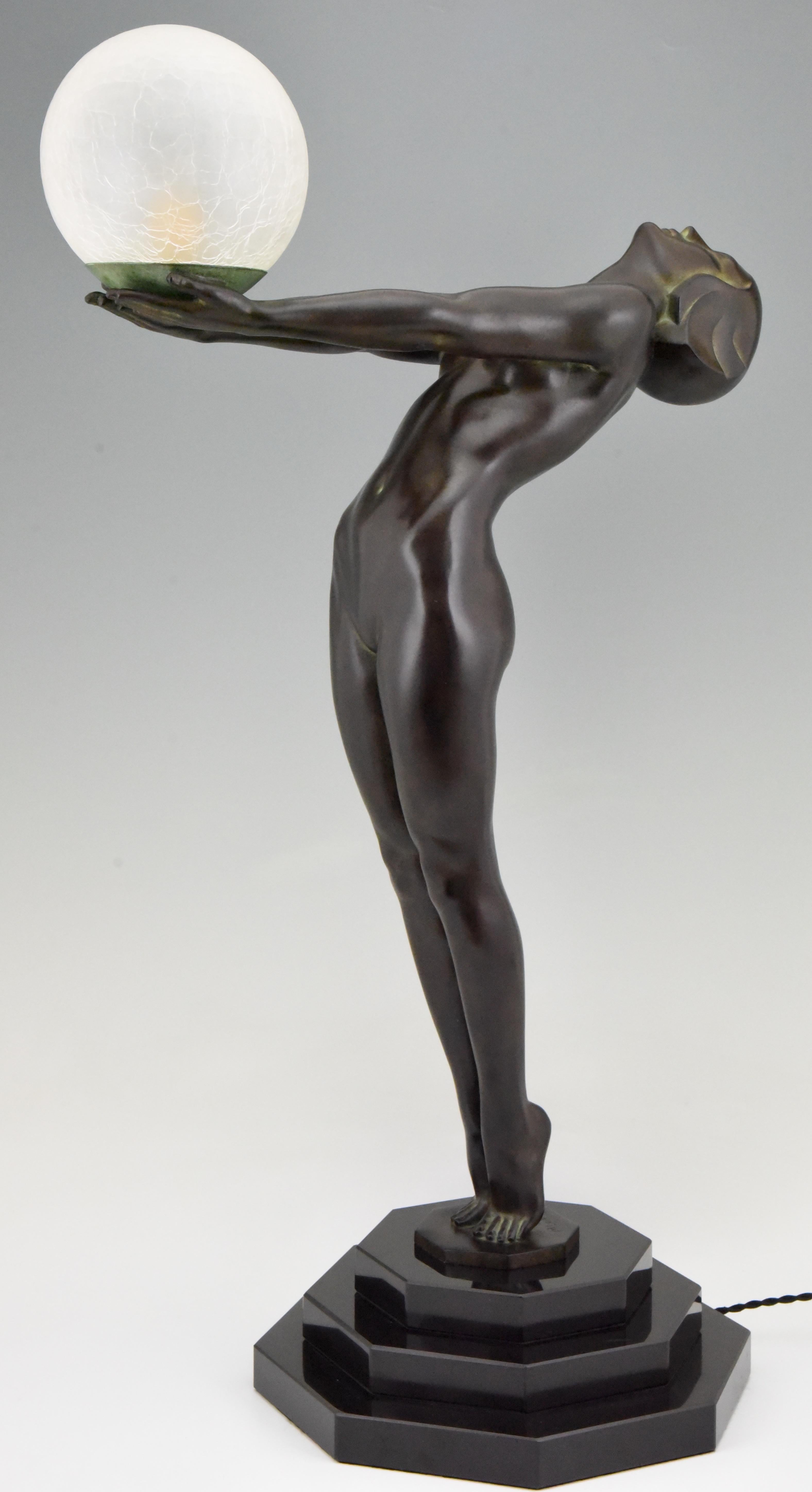 Patinated Art Deco style Lamp Clarté Nude with Globe by Max Le Verrier H. 33 inch / 84 cm For Sale
