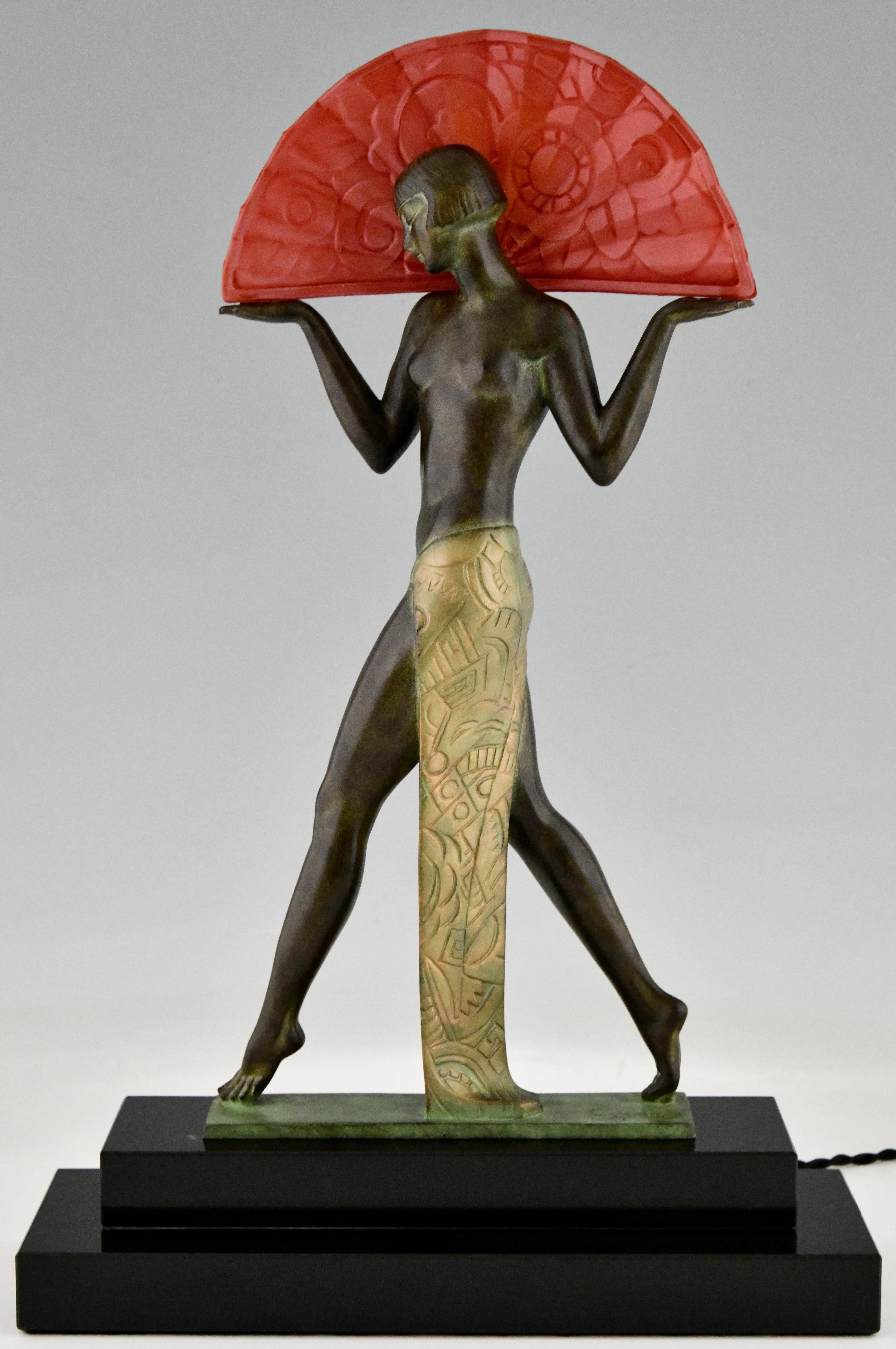 Espana an Art Deco style lamp Spanish dancer lady with fan.
Signed by Raymonde Guerbe with foundry seal.
Designed in 1920-1930.
Posthumous contemporary cast at the Le Verrier foundry. Patinated art metal, red glass fan and black marble base. 

This