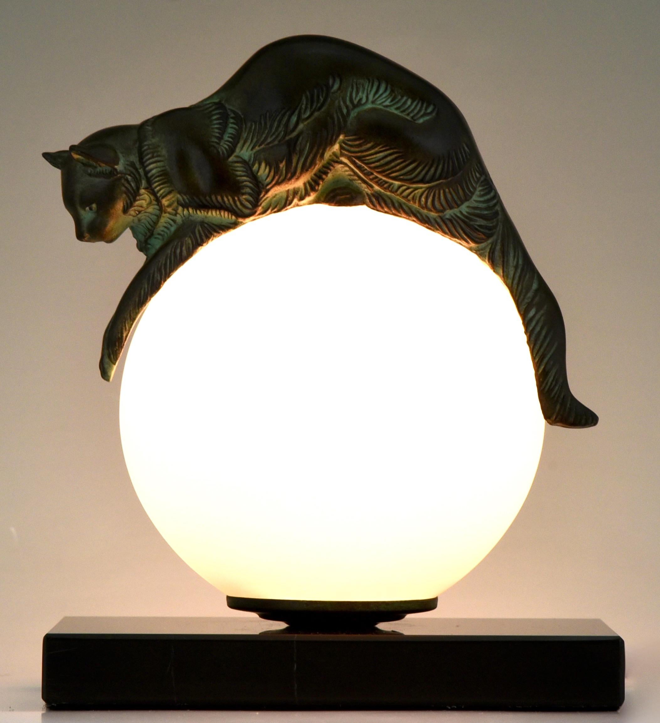 Art Deco style lamp with cat EQUILIBRE signed Gaillard for Max Le Verrier. 
With Max Le Verrier foundry seal. 
Design 1930. Posthumous contemporary cast. 
Patinated Art Metal on a black marble base with glass shade. 
With COA. 
US plug will be